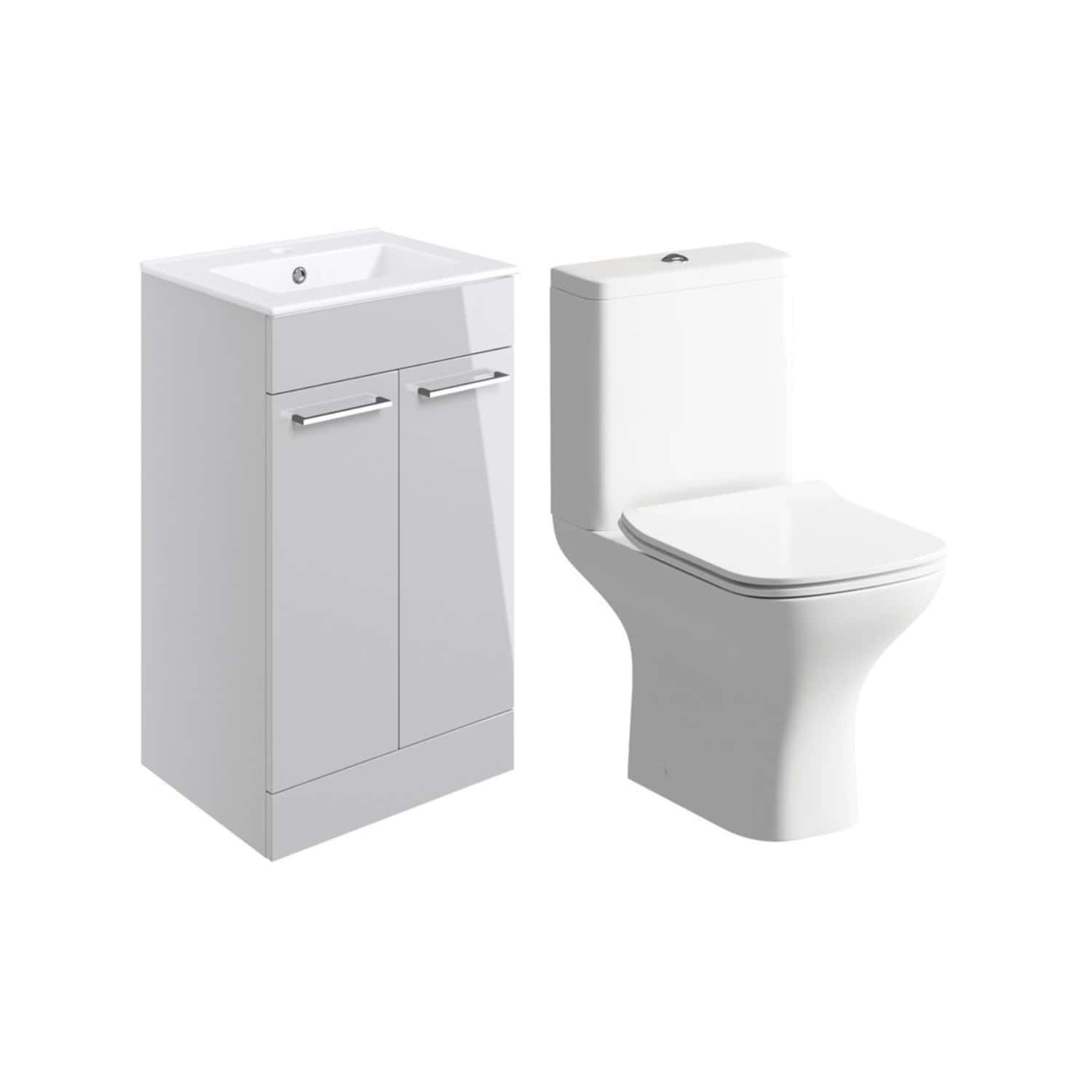 Sleek white bathroom vanity unit with integrated sink and chrome handles paired with a modern close-coupled toilet, ideal for contemporary bathroom designs.