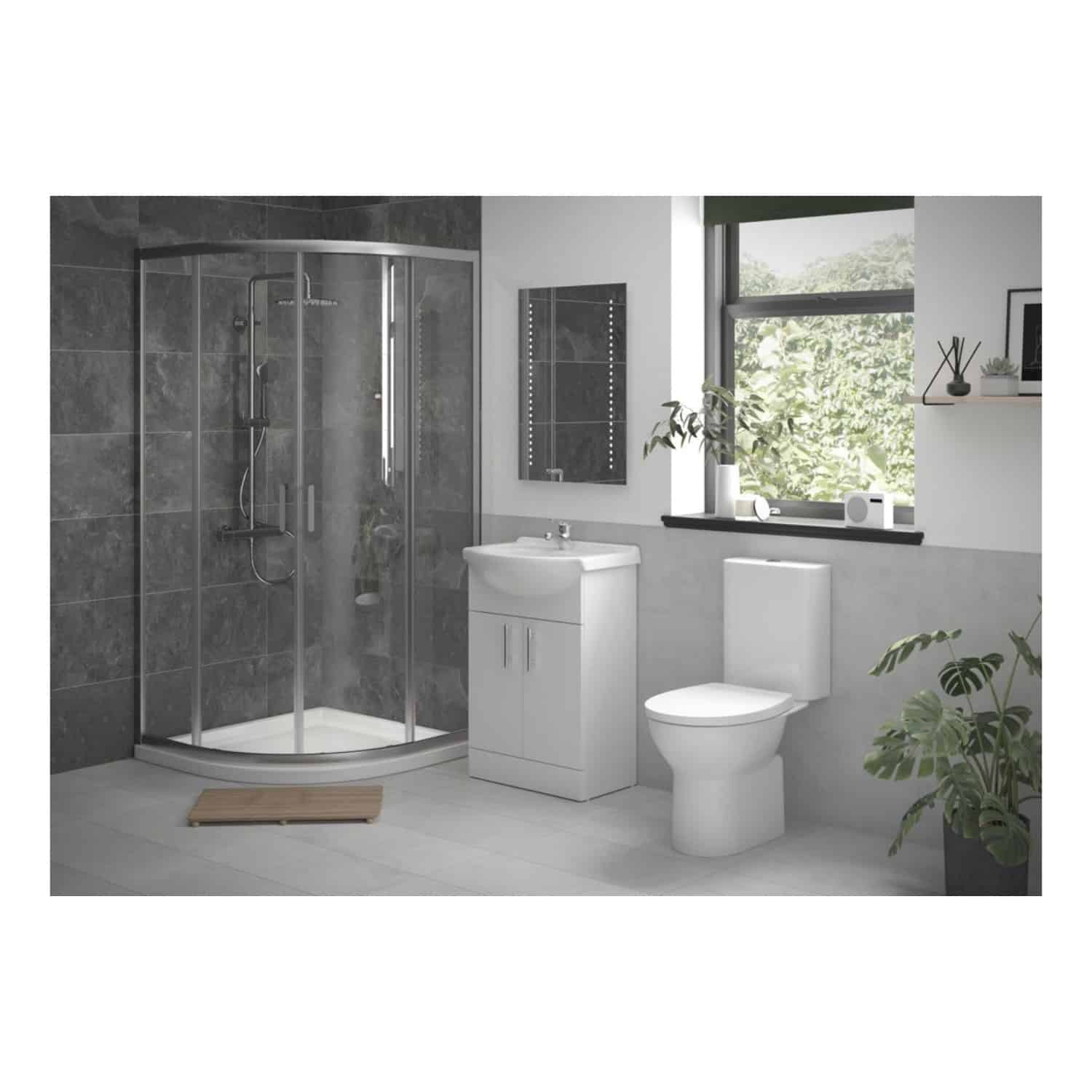 Modern bathroom with corner shower enclosure, white toilet, vanity unit, and window with greenery view, featuring contemporary bathroom fixtures and minimalistic decor.