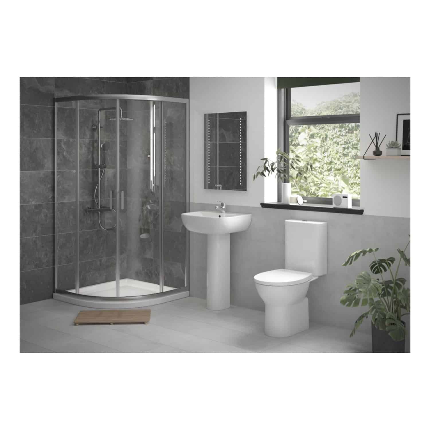 Shower enclosure with modern grey tiles, white toilet, and pedestal sink in a contemporary bathroom featuring large window with green view. Well-lit space with stylish decor and plants.