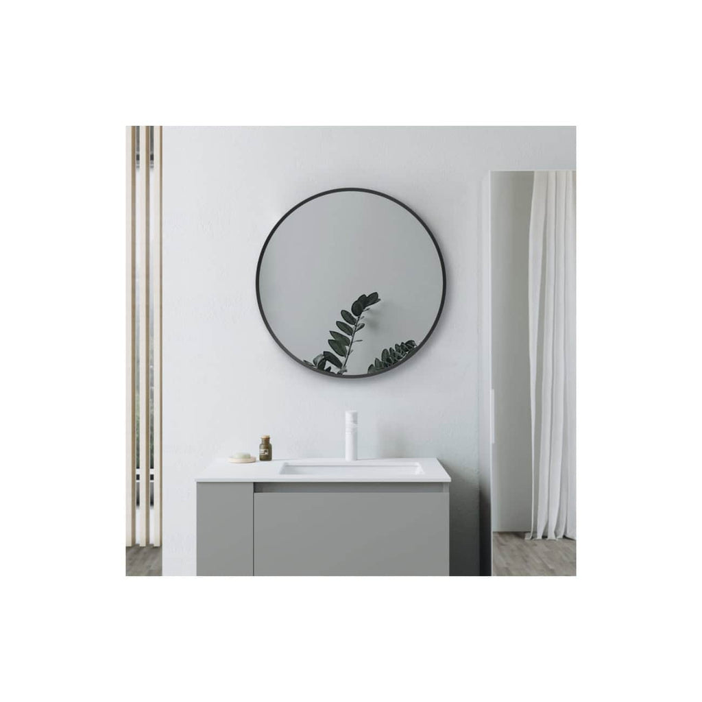 Minimalist bathroom vanity with a round mirror, white sink, and neutral décor, showcasing sleek design elements and modern style for elegant bathroom interiors.