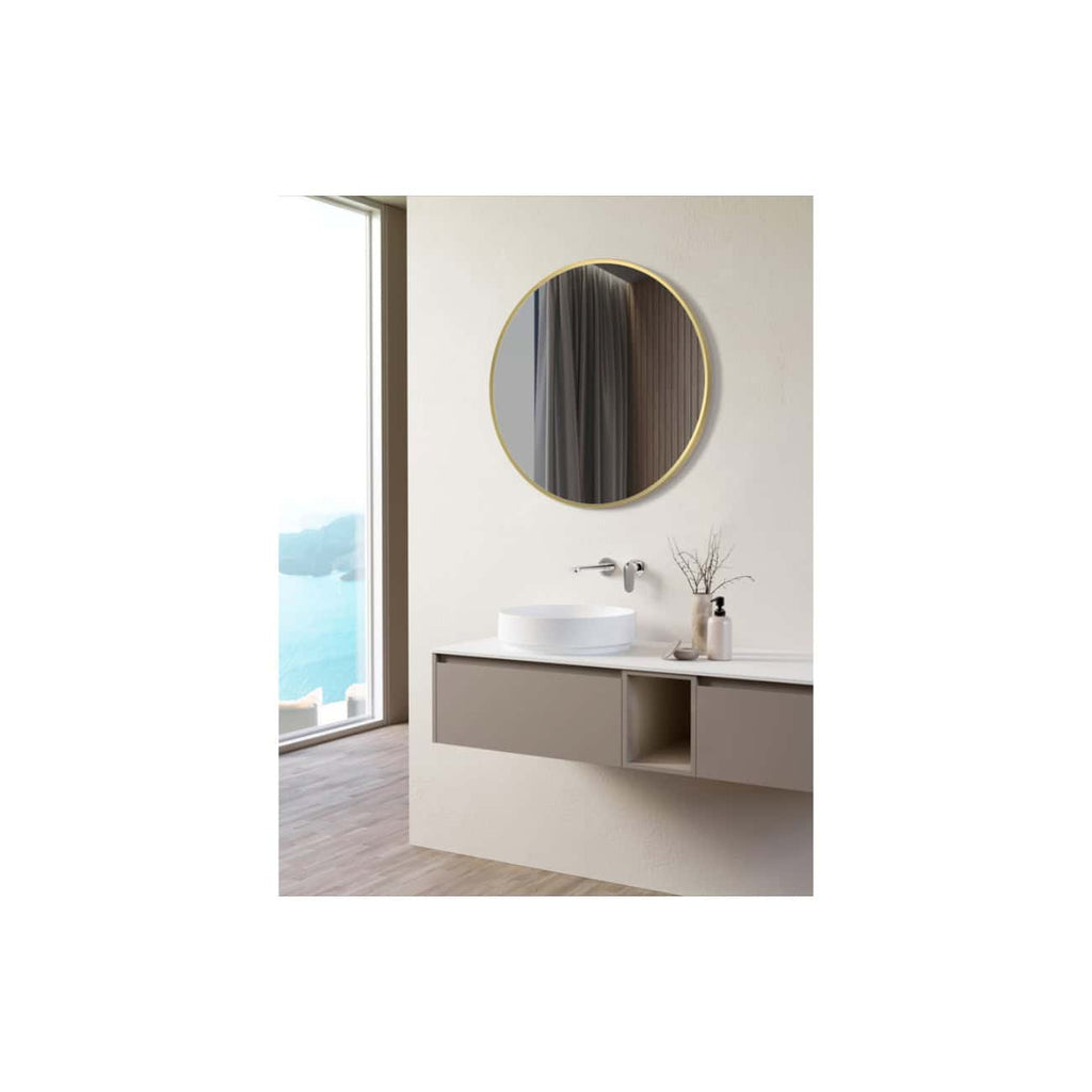 Sleek modern bathroom vanity with a circular wall-mounted mirror, minimalist sink, and neutral-toned cabinets overlooking a scenic view, perfect for contemporary bathroom design.