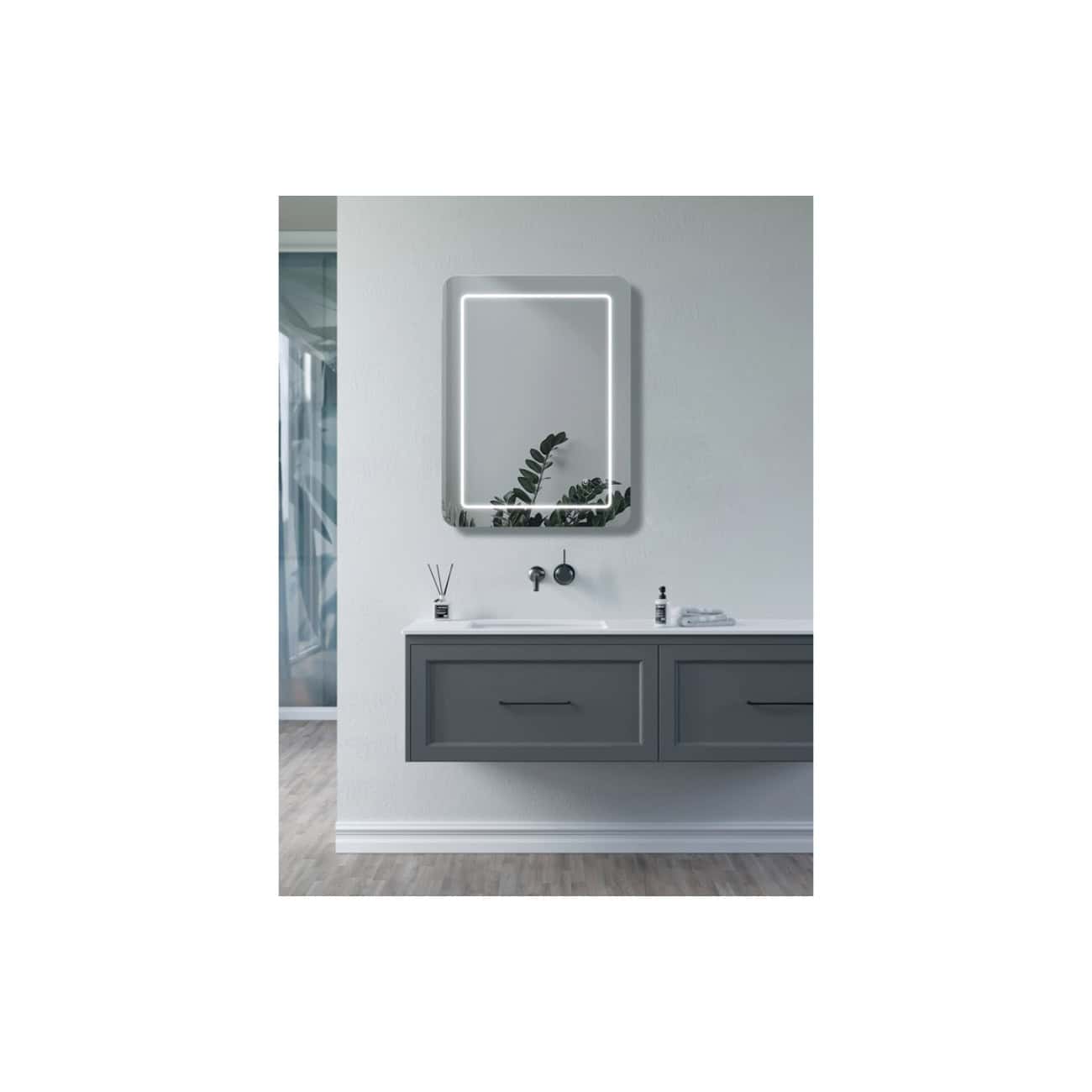 Sleek modern bathroom vanity with a dark grey cabinet, integrated white sink, and a stylish rectangular backlit mirror, creating a contemporary and functional bathroom space.