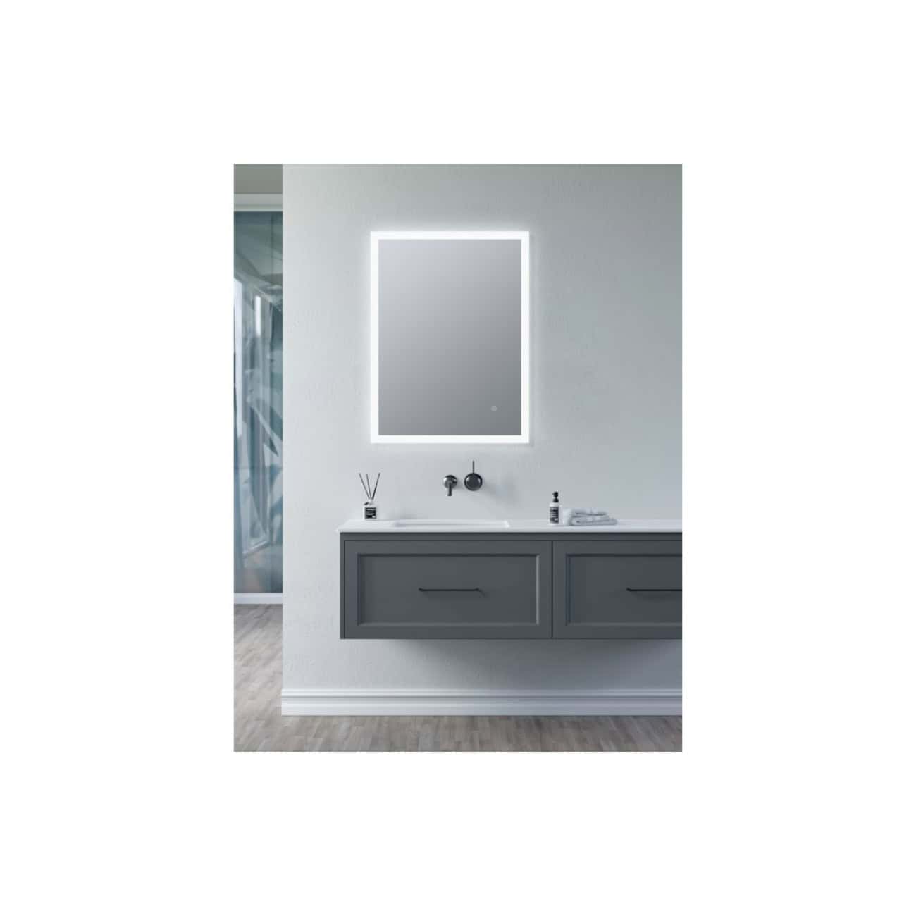 Sleek modern bathroom vanity with grey cabinet, illuminated mirror, and minimalist sink setup, perfect for contemporary bathroom design and interior decor.