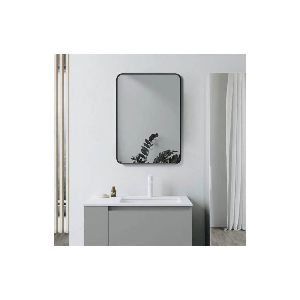 Sleek modern bathroom vanity with a minimalist design featuring a grey cabinet, a white countertop sink, and a large rectangular mirror with black trim. Elegant and functional setup ideal for contemporary bathroom spaces.