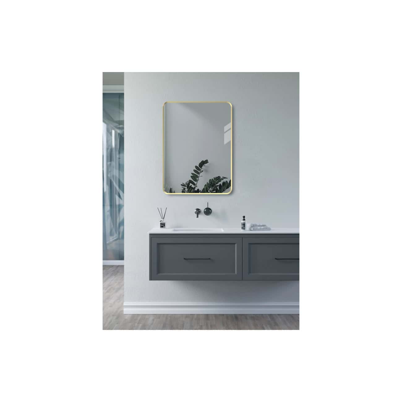 Modern grey bathroom vanity with sleek cabinet drawers, a white countertop, and a stylish rectangular mirror featuring a gold frame, creating a minimalist and contemporary bathroom look.