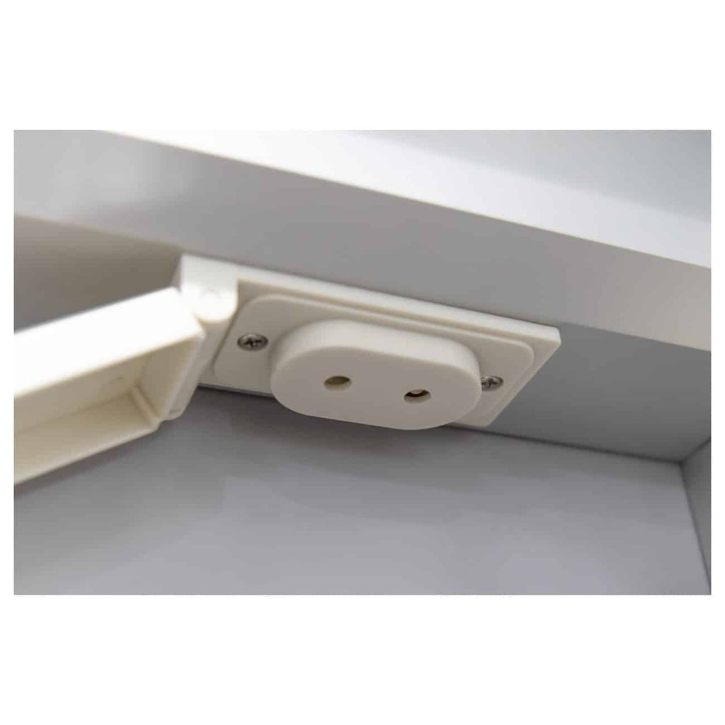 Easy-to-install white electrical power outlet with a protective cover, integrated into a kitchen or bathroom cabinet for safe and convenient power access in modern bathroom design.