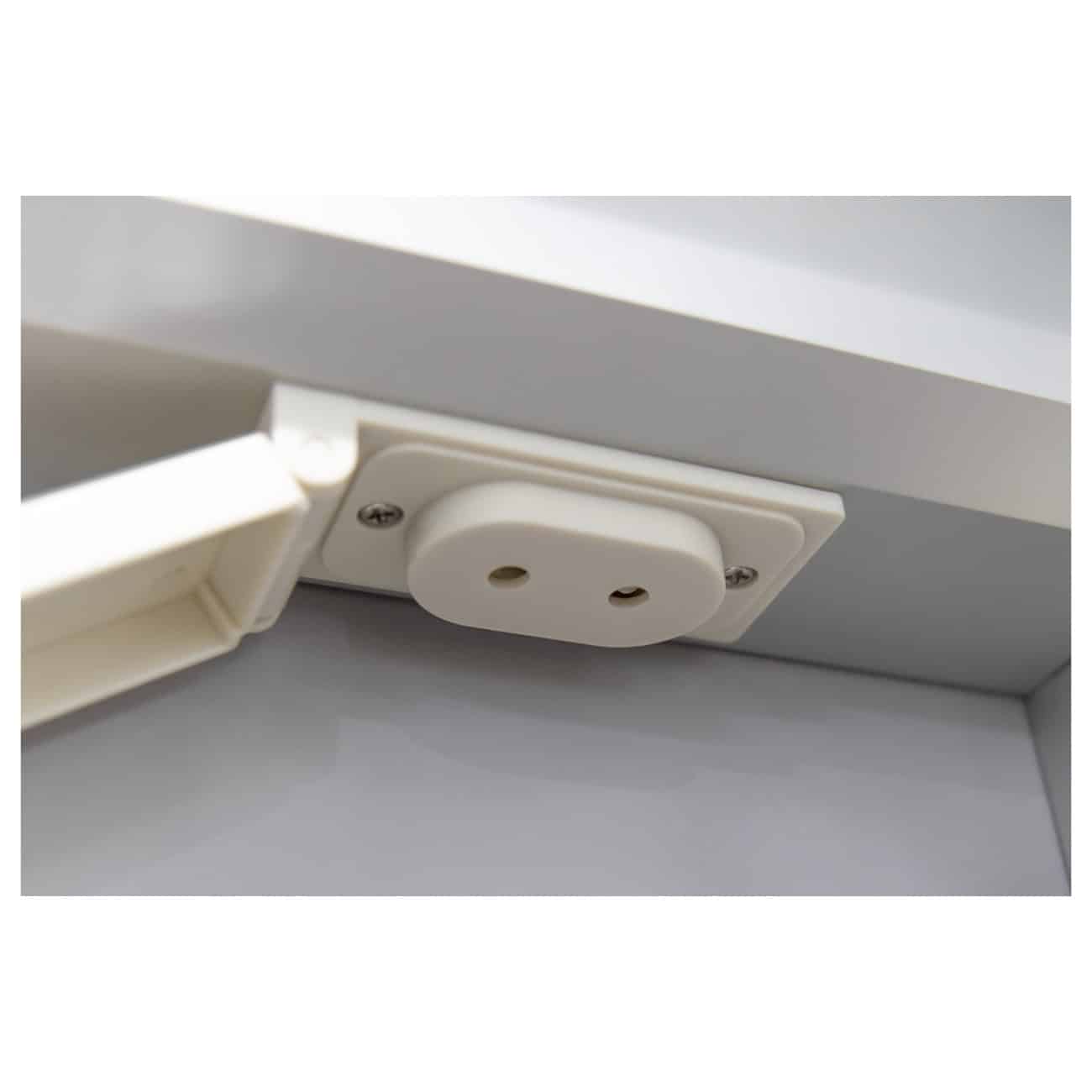 Easy-to-install white electrical power outlet with a protective cover, integrated into a kitchen or bathroom cabinet for safe and convenient power access in modern bathroom design.