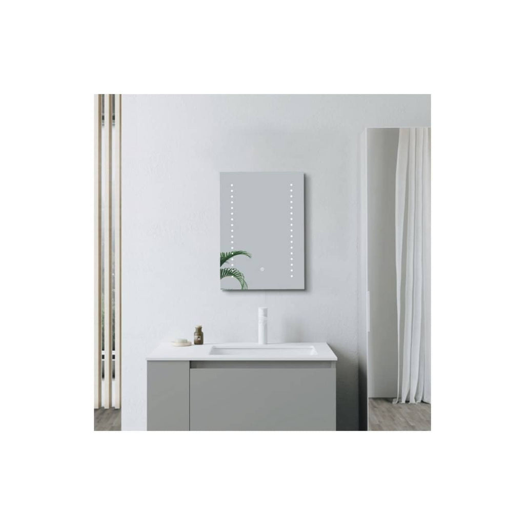 Contemporary grey bathroom vanity with integrated sink, minimalist mirror with LED lighting, decorative plants, and sleek design elements for modern bathroom decor.