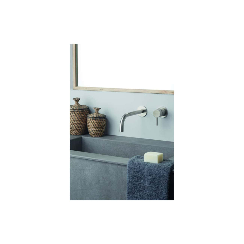 Elegant modern bathroom sink with sleek wall-mounted chrome faucet, minimalist design, and neutral colour palette, perfect for contemporary bathroom decor.