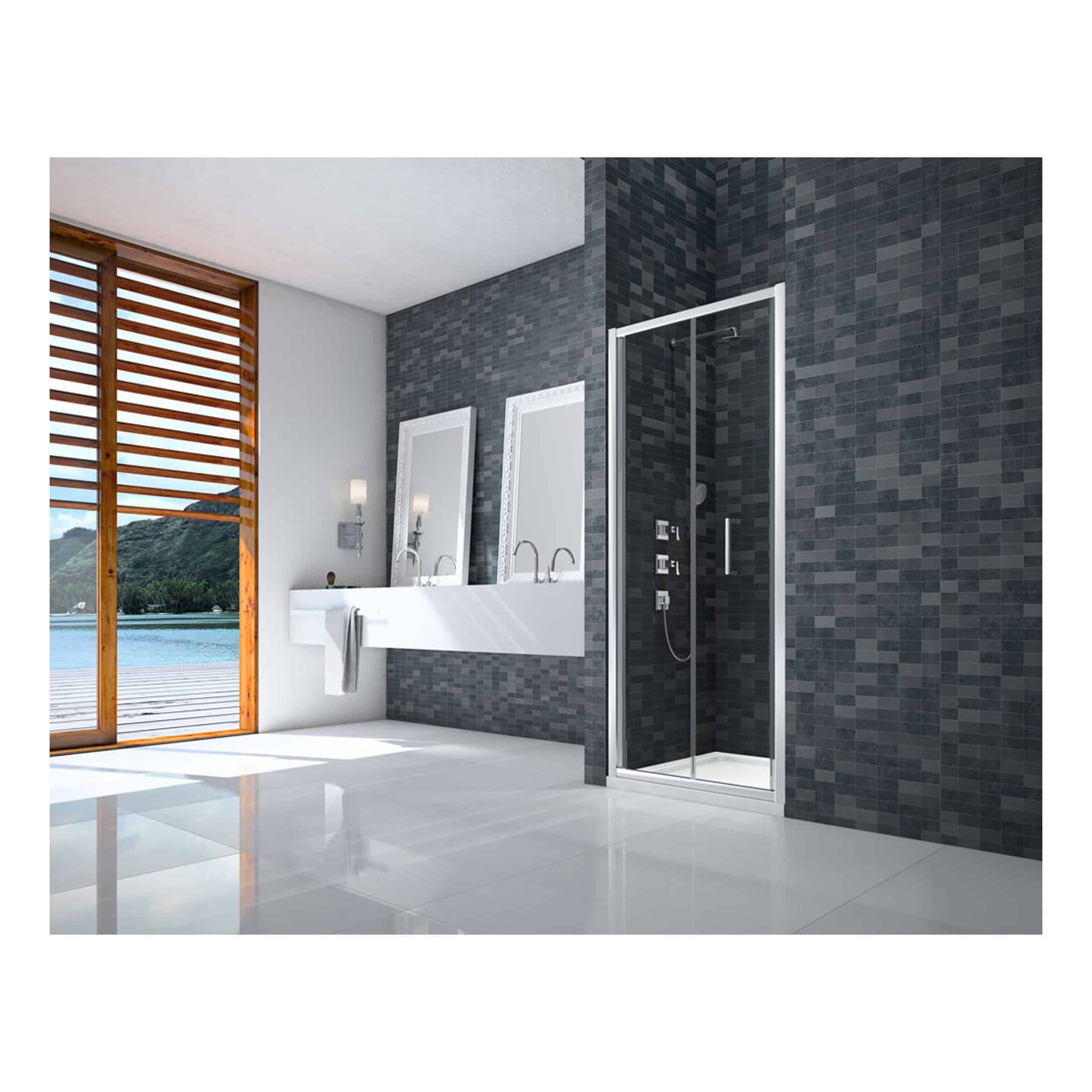 Modern bathroom with walk-in shower, double sinks, and large window with scenic water view, featuring dark tile walls and sleek fixtures for contemporary bathroom design.