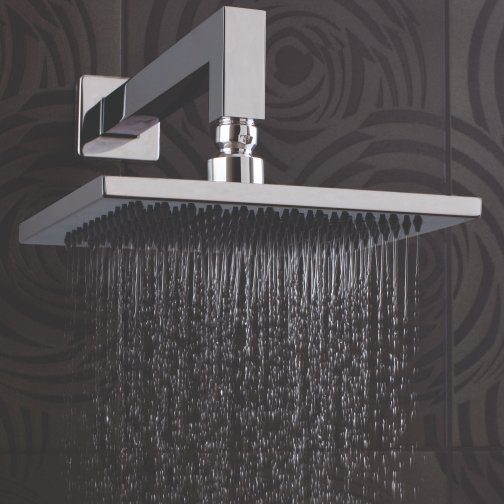 Luxurious chrome rainfall showerhead with flowing water, modern bathroom fixture, chrome finish, stylish grey textured wall background, ideal for contemporary bathroom design.