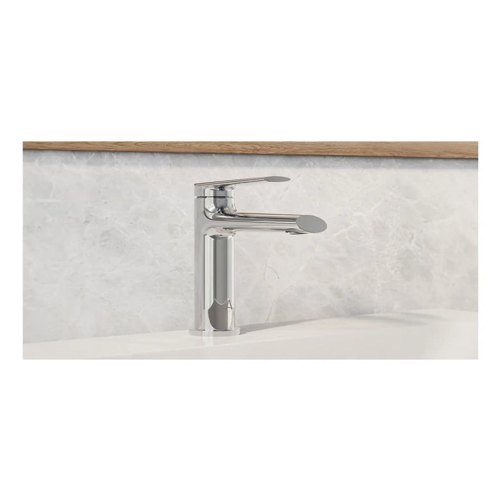 Sleek chrome bathroom mixer tap with modern design, installed on a white ceramic sink against a marble backsplash and wooden trim, perfect for contemporary bathroom decor.
