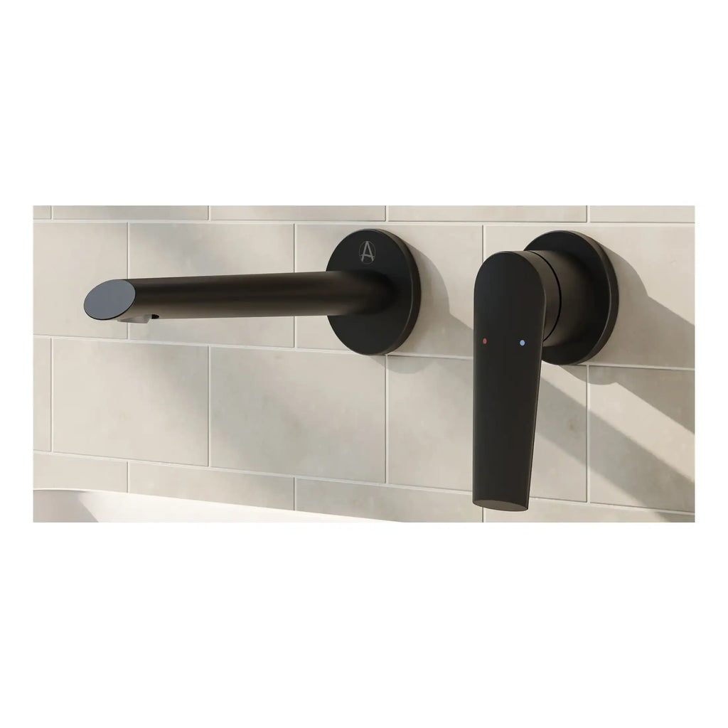 Sleek black wall-mounted bathroom tap and digital control lever on white tiled wall, modern bathroom fixtures, Bubly Bathrooms, contemporary design for stylish bathrooms.