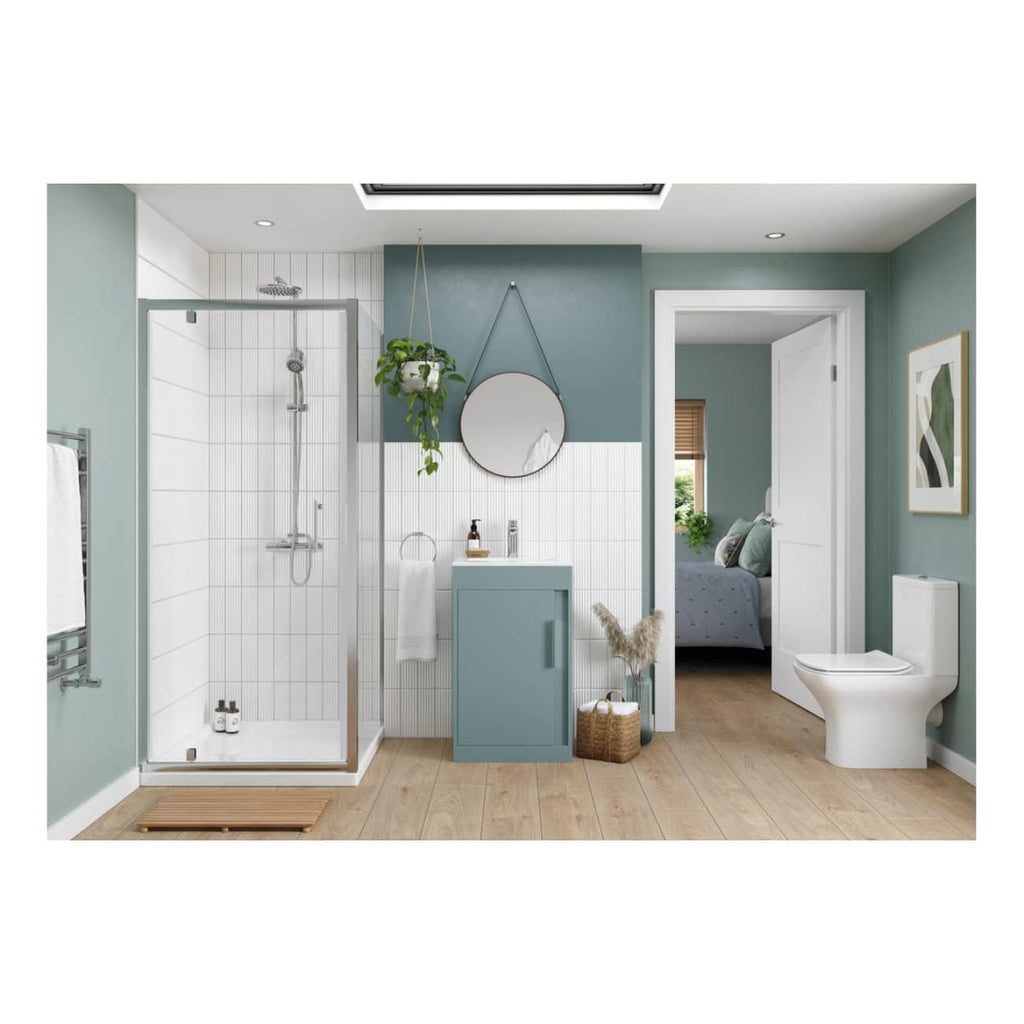 Bright modern bathroom featuring a walk-in shower, green accents, and stylish decor, perfect for a contemporary bathroom renovation with Bubly Bathrooms.