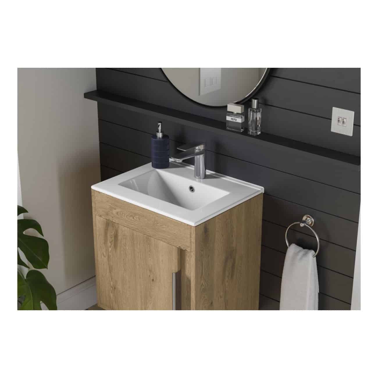 Sleek bathroom vanity with modern sink, wooden cabinet, and black wall panel; features a mirror, towel ring, and bathroom essentials for stylish bathroom design.
