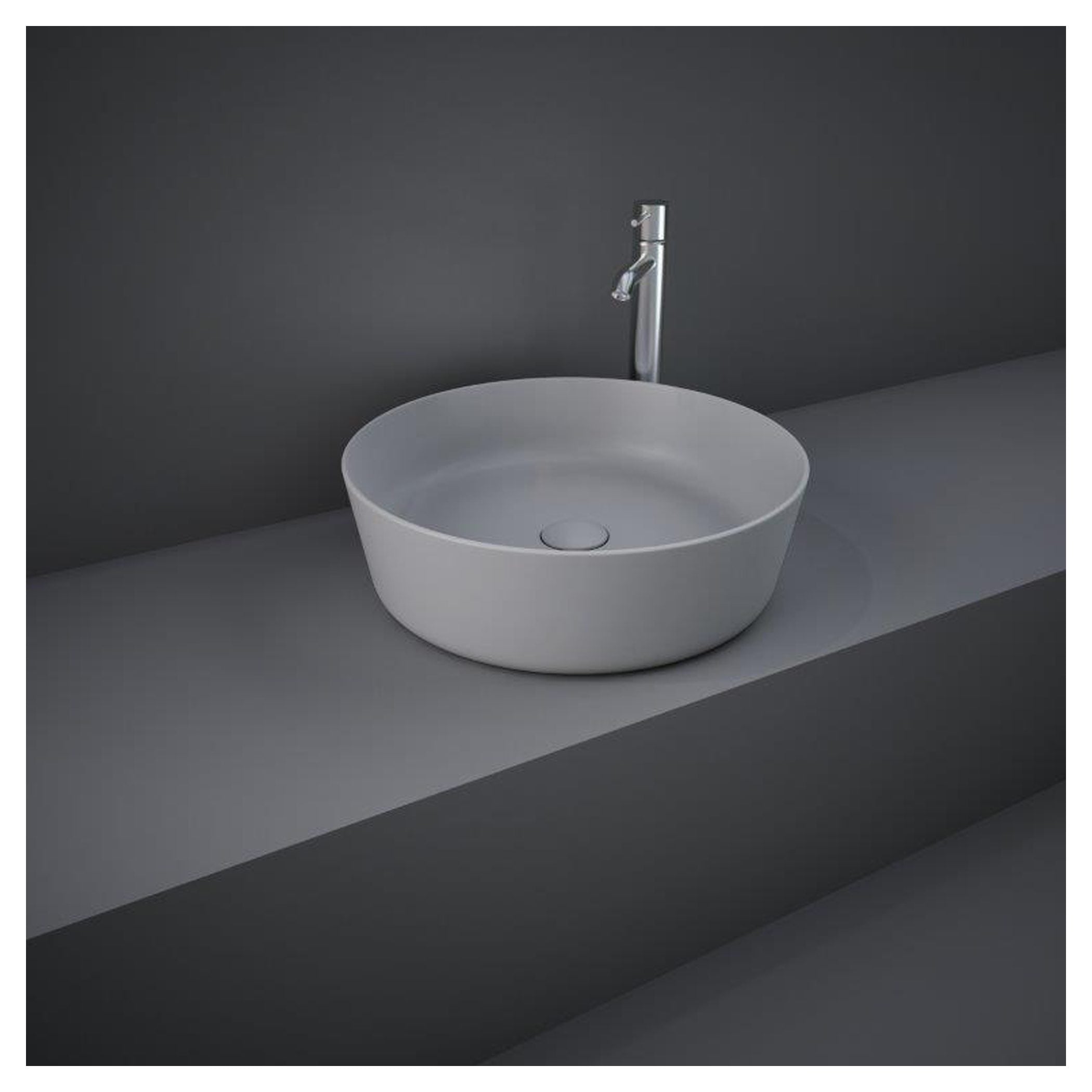 Modern white bathroom sink with sleek chrome tap on grey countertop, minimalistic design perfect for contemporary bathrooms, high-quality fixtures, and stylish bathroom essentials.