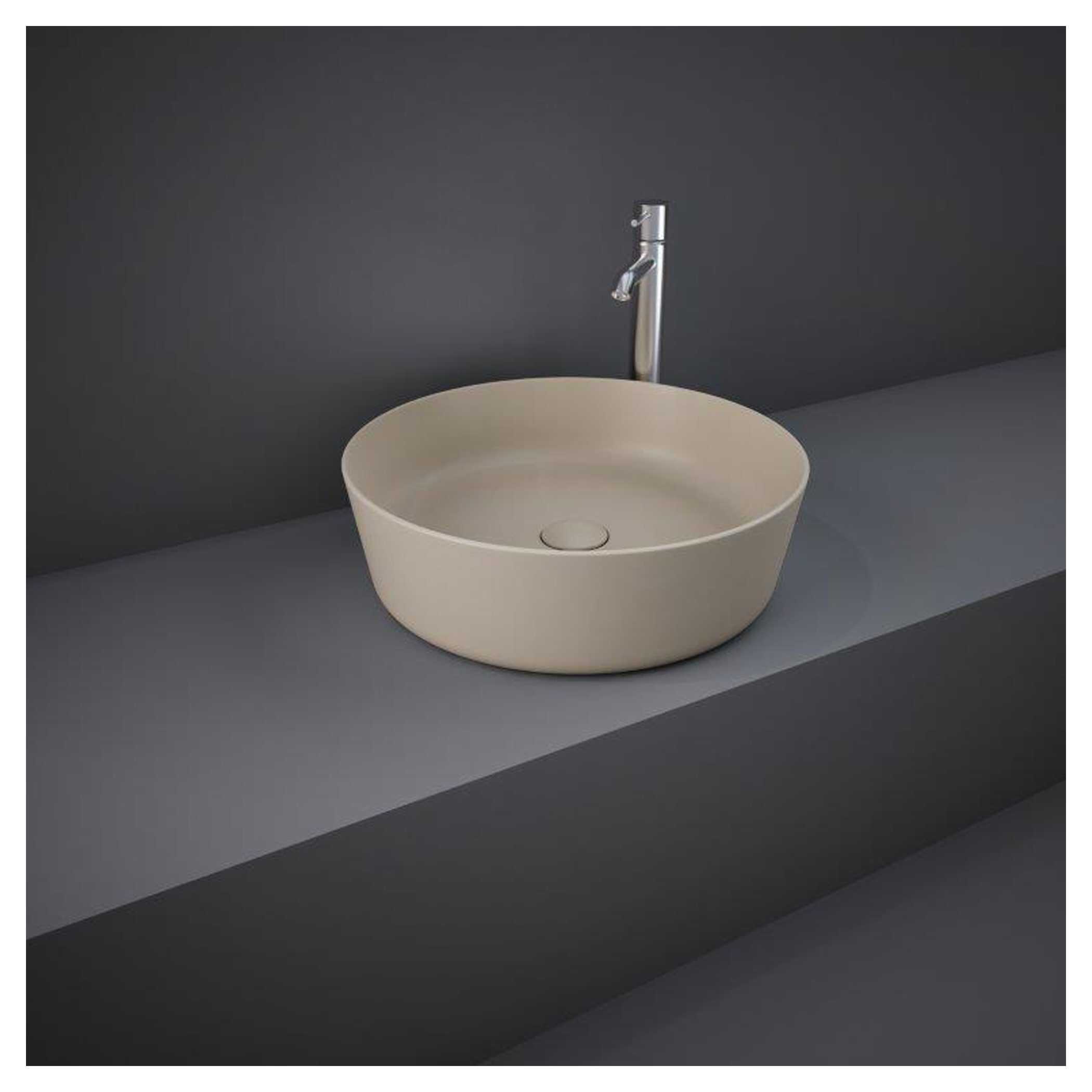 Sleek beige bathroom basin with modern design and chrome tap on grey countertop, ideal for contemporary bathroom decor. Perfect for bathroom renovation and fixtures.