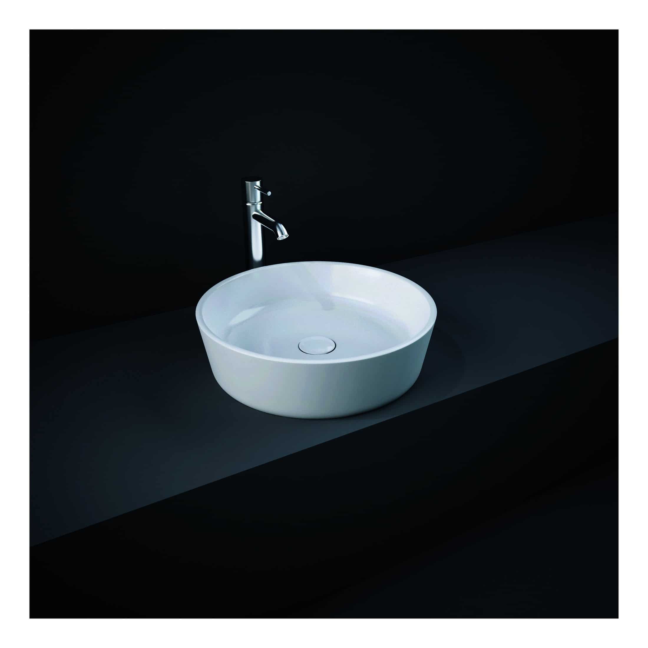 Polished white bathroom sink with modern chrome tap on black countertop, sleek minimalist design, perfect for contemporary bathroom decor.