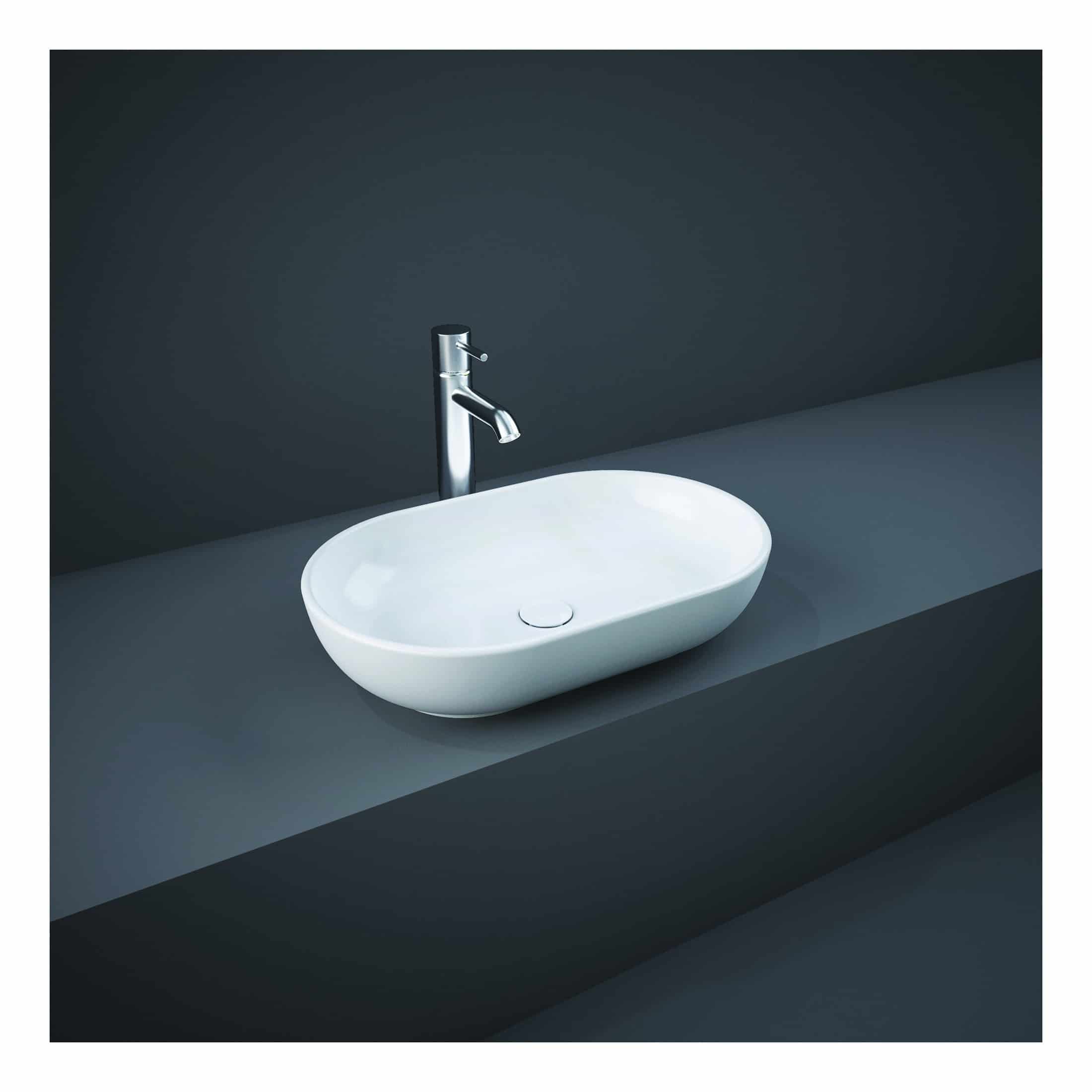 Modern white bathroom sink with sleek chrome faucet on dark grey countertop, minimalist bathroom design, contemporary washbasin, bathroom fixtures, stylish and functional bathroom sink.
