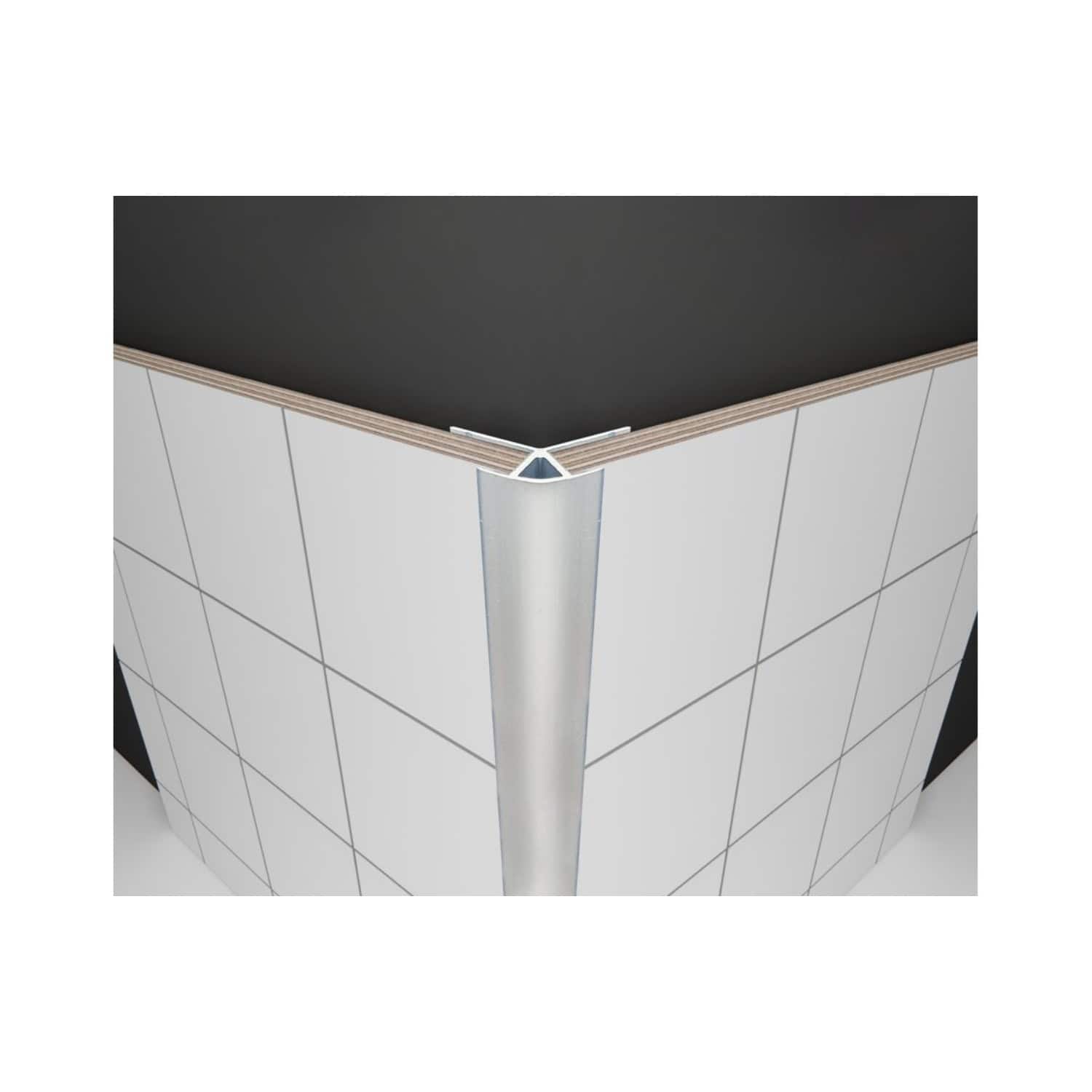 Sleek corner detail of modern bathroom with white tiled walls, black countertop, and stainless steel trim, showcasing contemporary design and high-quality bathroom fittings.