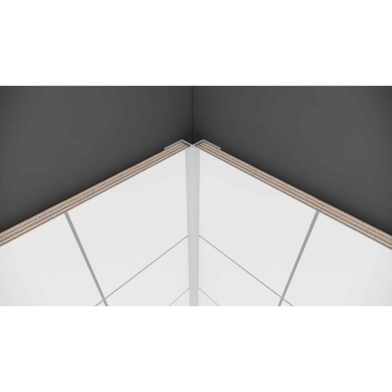 Modern bathroom corner with sleek black and white tiled walls, featuring minimalist design and clean lines for elegant bathroom renovation and cabinetry.