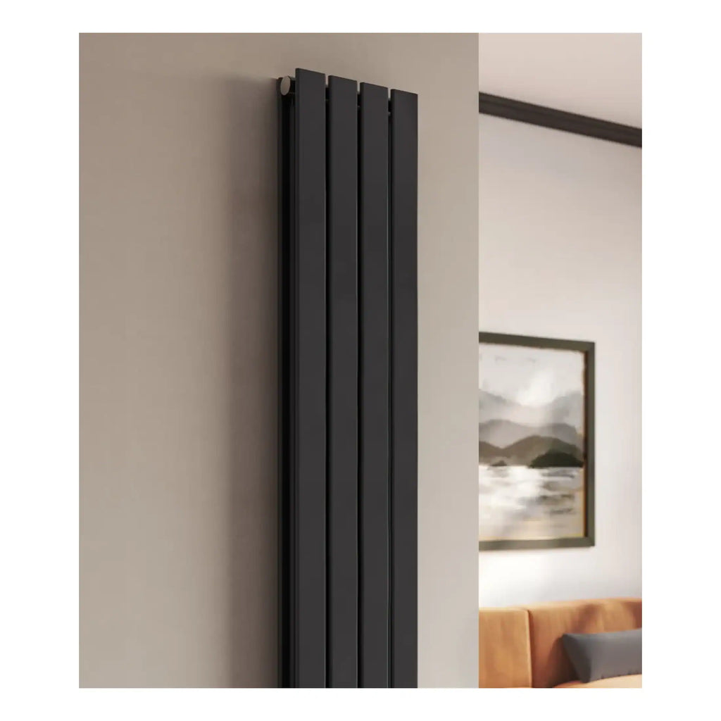 Contemporary black vertical radiator in modern bathroom setting with beige walls and minimalist decor, ideal for stylish bathroom heating solutions.