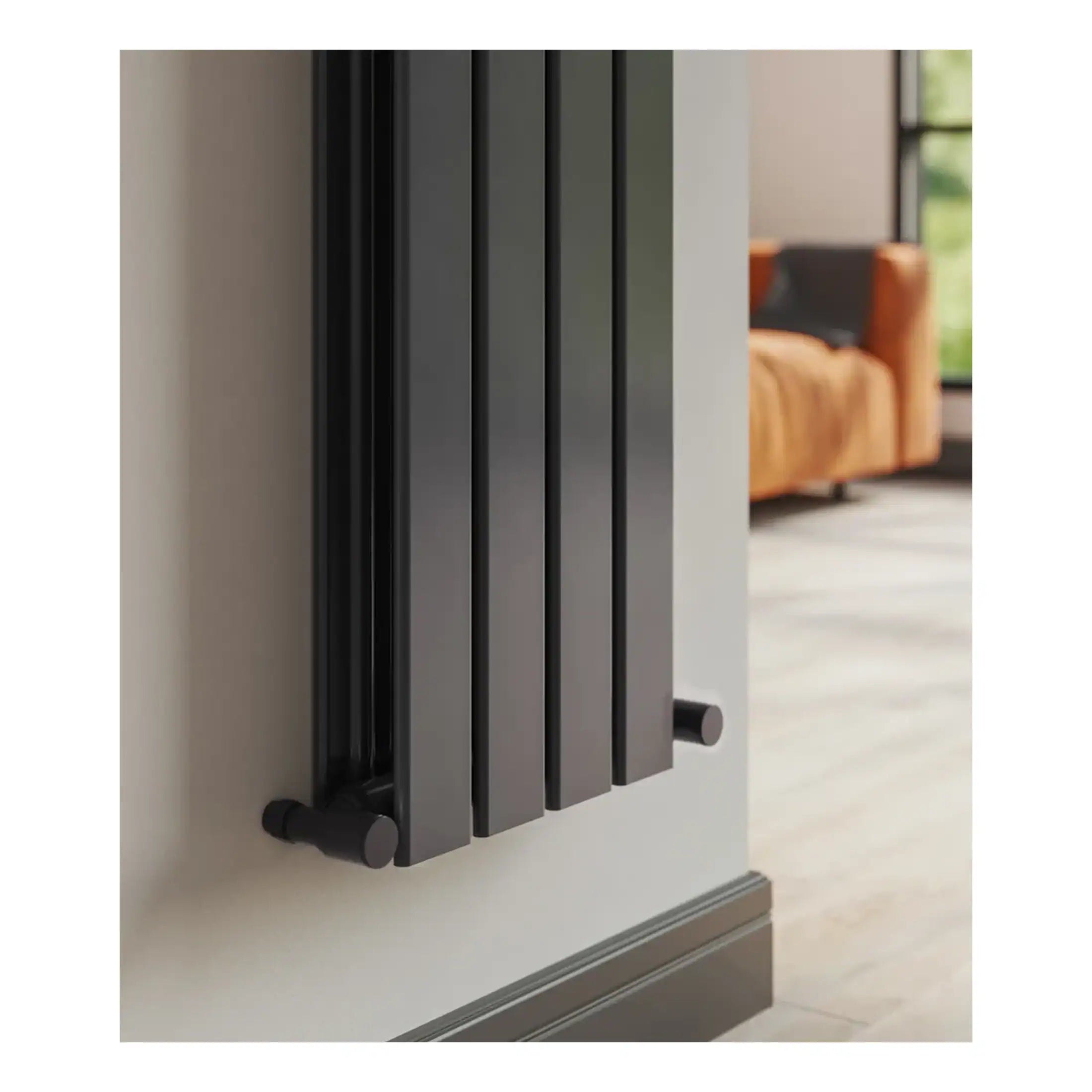 Modern black radiator heater installed on a clean white wall in a contemporary bathroom or living space.