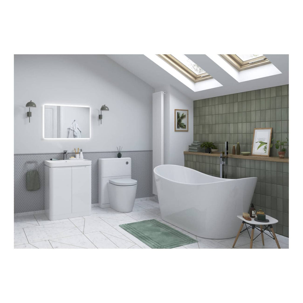 Modern bathroom with sleek white fixtures, freestanding bathtub, grey tiled accent wall, and natural light from skylights, designed for stylish and functional bubly bathroom interiors.