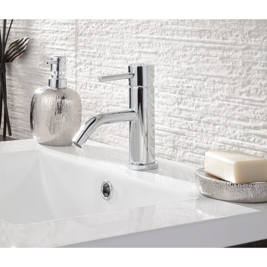 Shiny chrome bathroom tap with modern design, placed on a white ceramic sink with soap and decorative jar, ideal for contemporary Bubly Bathrooms.