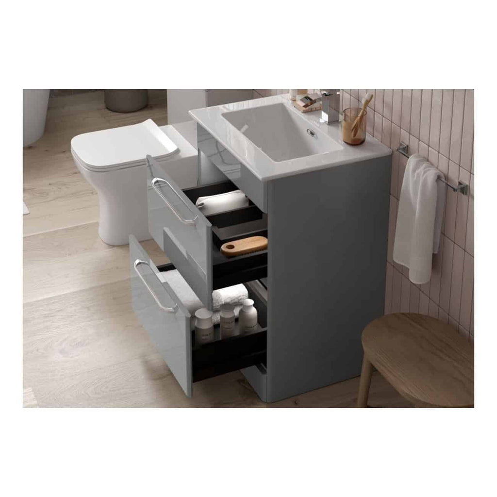 Sleek modern bathroom vanity with integrated sink, grey cabinetry, and open storage drawers for bathroom essentials in contemporary design.