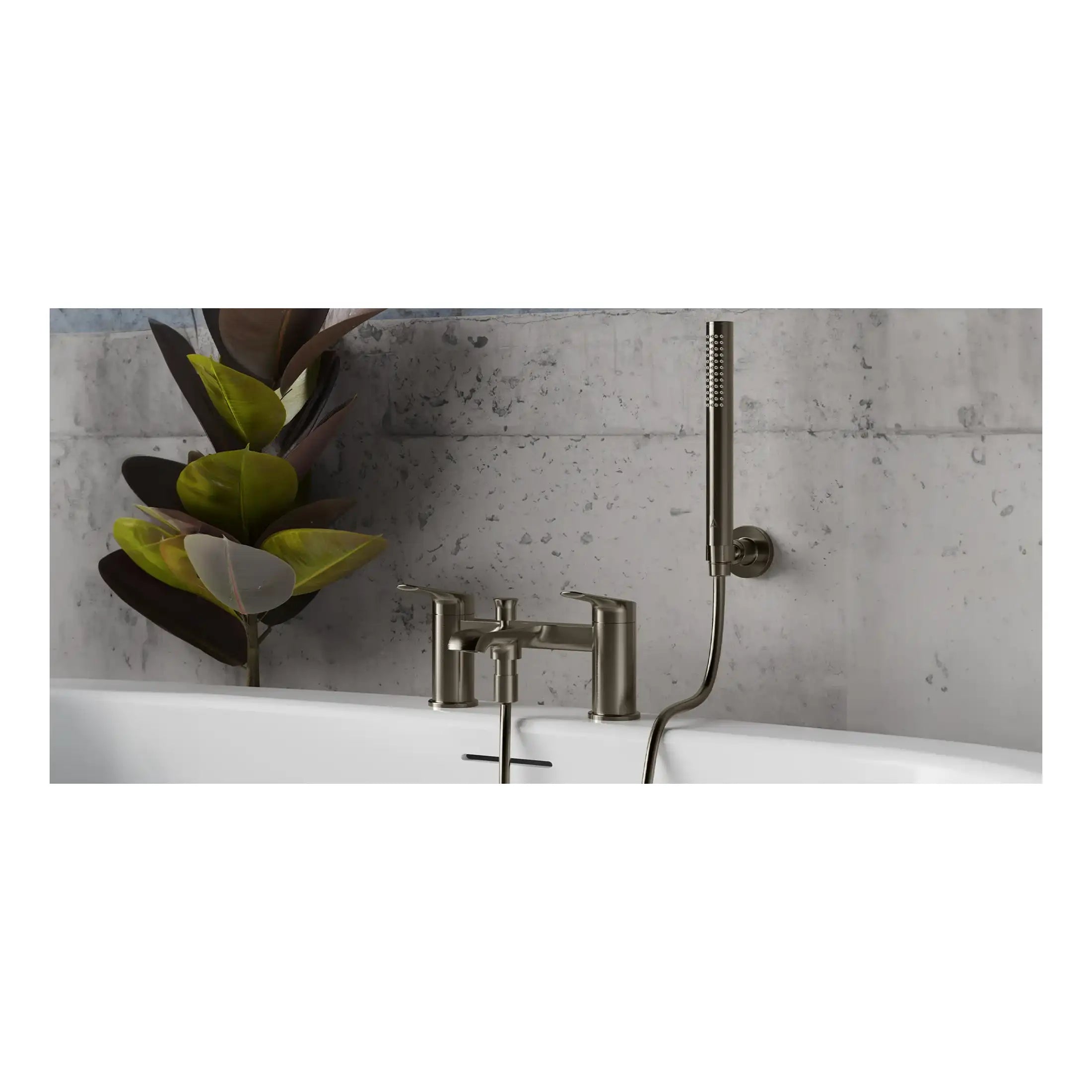 Contemporary bathtub tap and handheld shower fixture with sleek brushed nickel finish, modern design for stylish bathrooms, set against textured concrete wall with large green plant for a minimalist aesthetic.