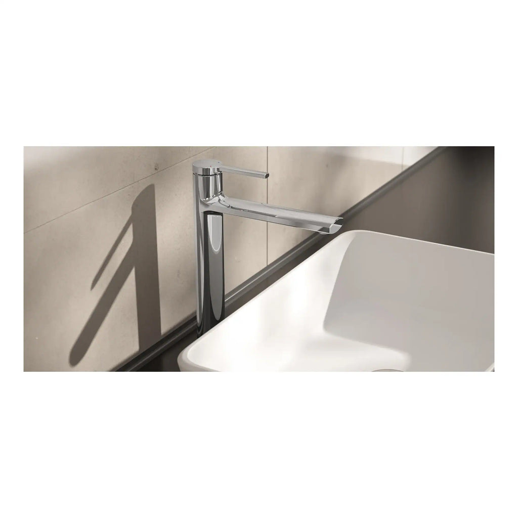 Sleek chrome bathroom tap mounted on countertop with shadow casting on beige tiled wall, modern style sink fixture, high-quality kitchen and bathroom fixtures, Bubly Bathrooms collection.