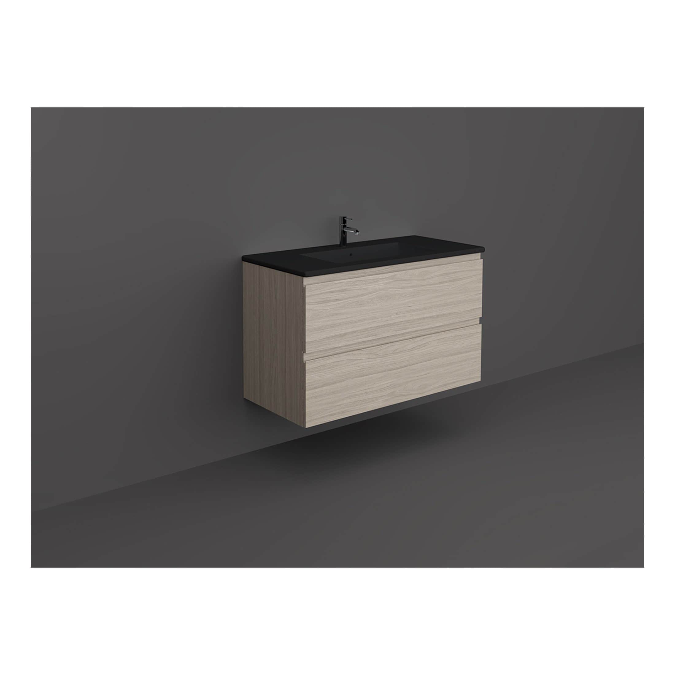 Sleek modern bathroom vanity with a black countertop and integrated sink, featuring light wood finish drawers, ideal for contemporary bathroom décor, stylish and functional.
