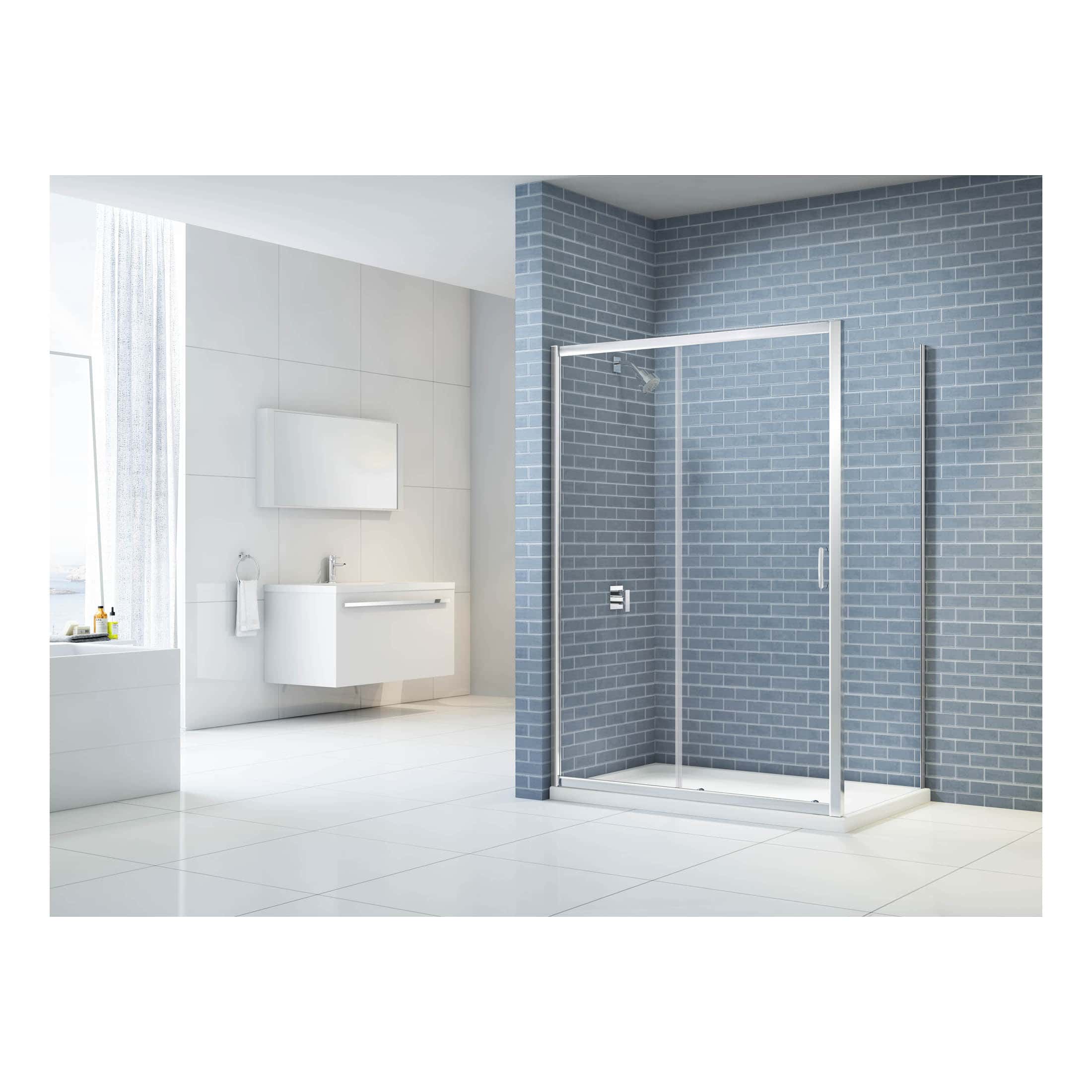 Modern bathroom with a sleek glass shower enclosure, white floating vanity with mirror, and minimalist design. Featuring blue brick accent wall, white tiled flooring, and bright natural lighting.