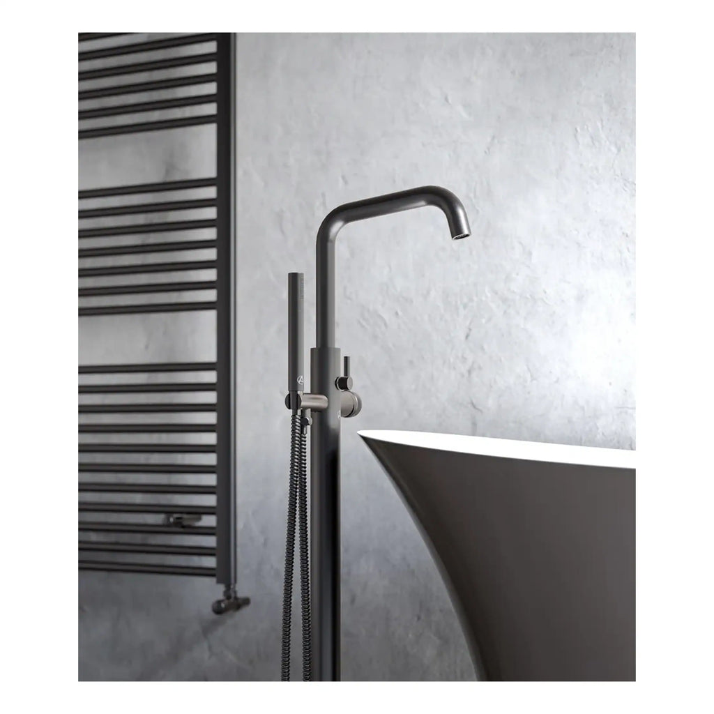 Sleek modern bathroom tap and hand shower with minimalist design, mounted near a stylish freestanding bathtub in a contemporary bathroom setting.