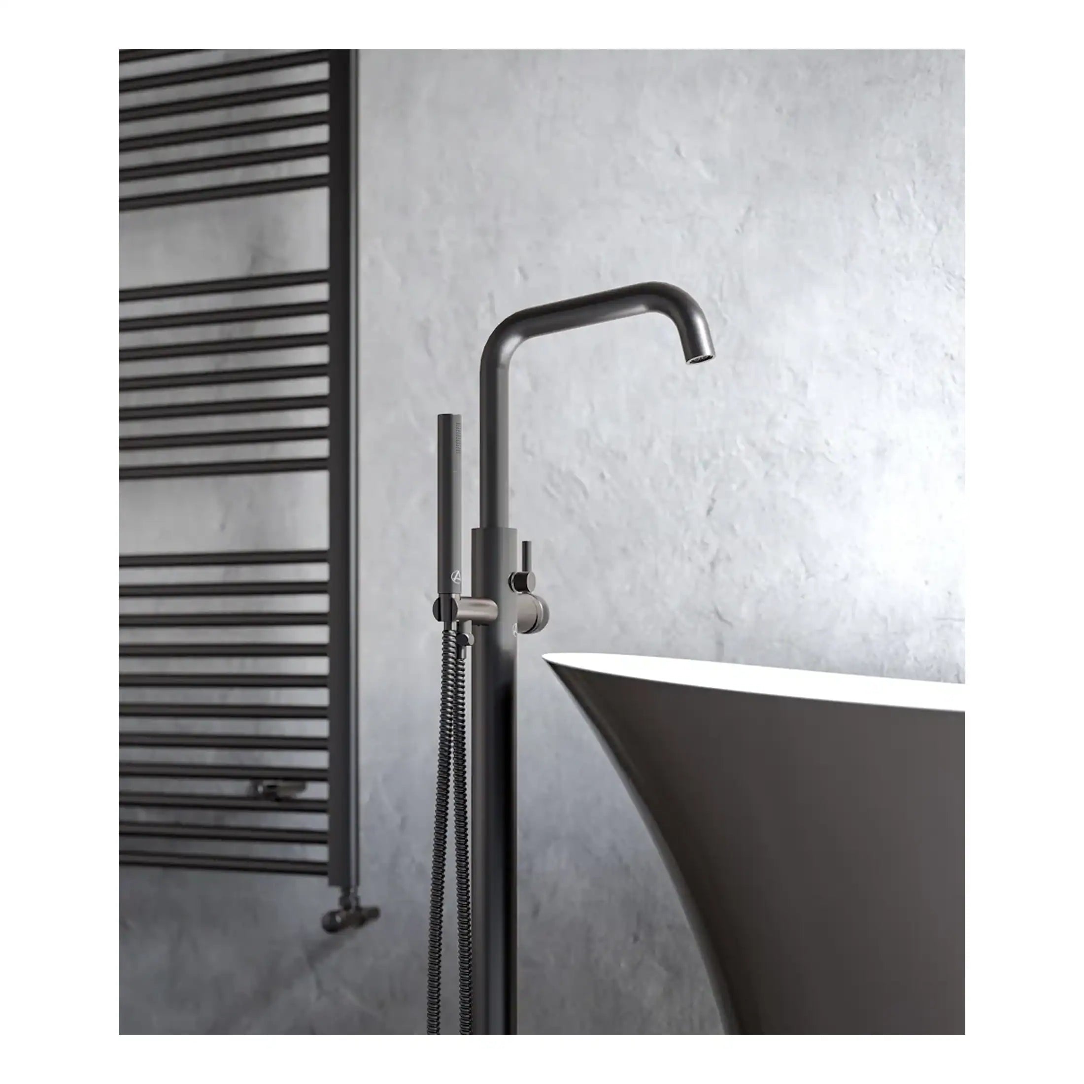 Sleek modern bathroom tap and hand shower with minimalist design, mounted near a stylish freestanding bathtub in a contemporary bathroom setting.
