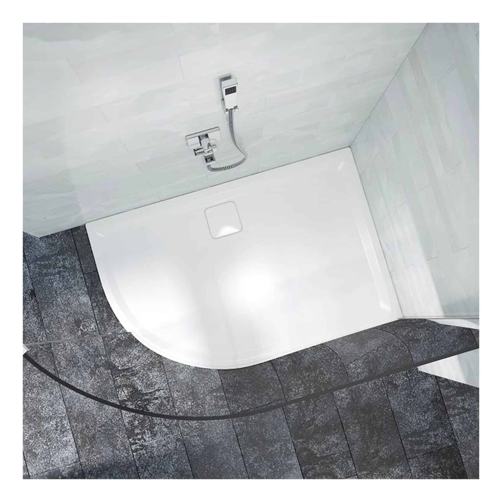 Modern walk-in shower with white acrylic base and sleek wall-mounted shower system, complemented by dark textured stone floor tiles for a contemporary bathroom design.