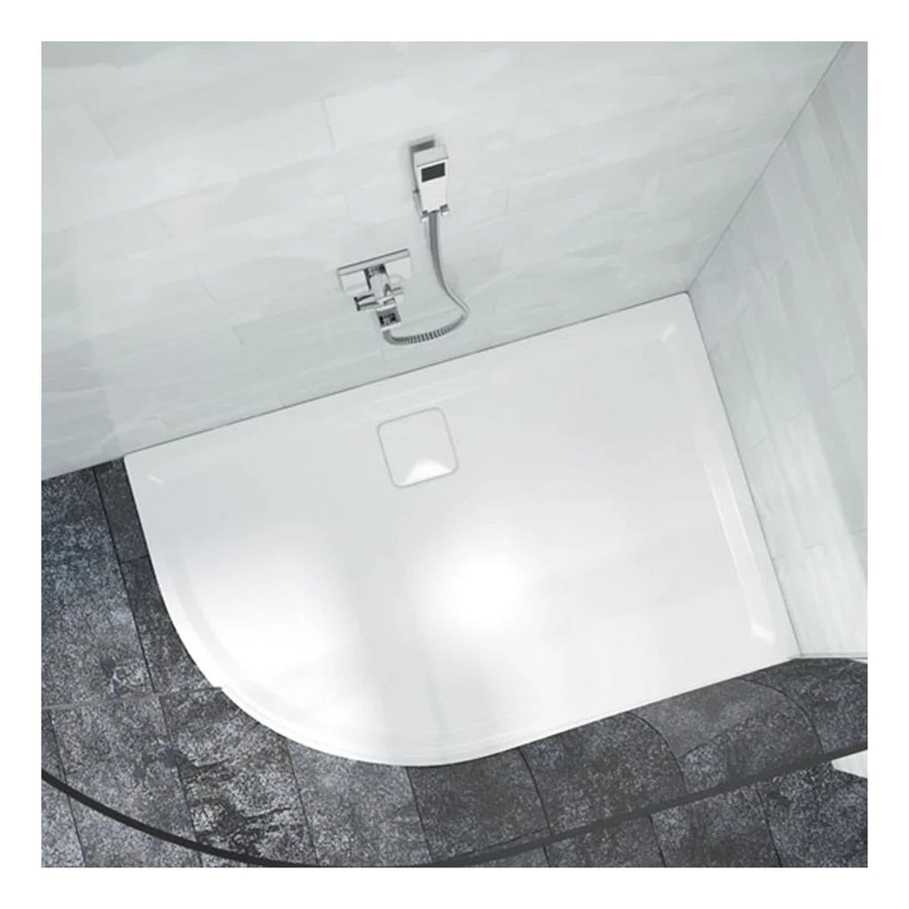 Modern walk-in shower with sleek white flooring and contemporary fixtures, enhancing bathroom style and functionality.
