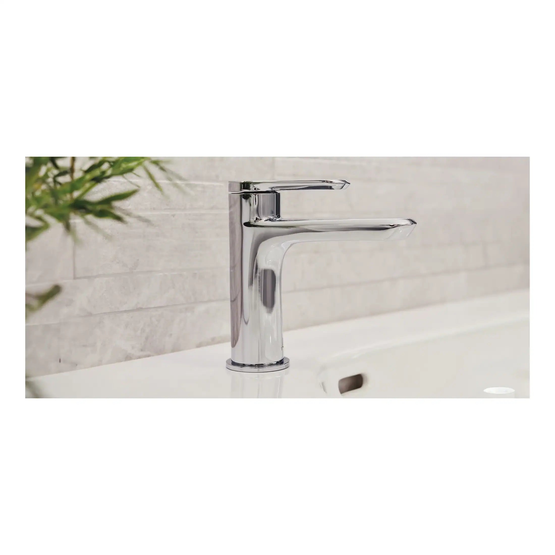 Sleek chrome bathroom tap on white basin with textured beige tile wall in background. Modern and stylish design perfect for contemporary bathroom decor. High-quality fixtures for a luxurious bathroom experience.