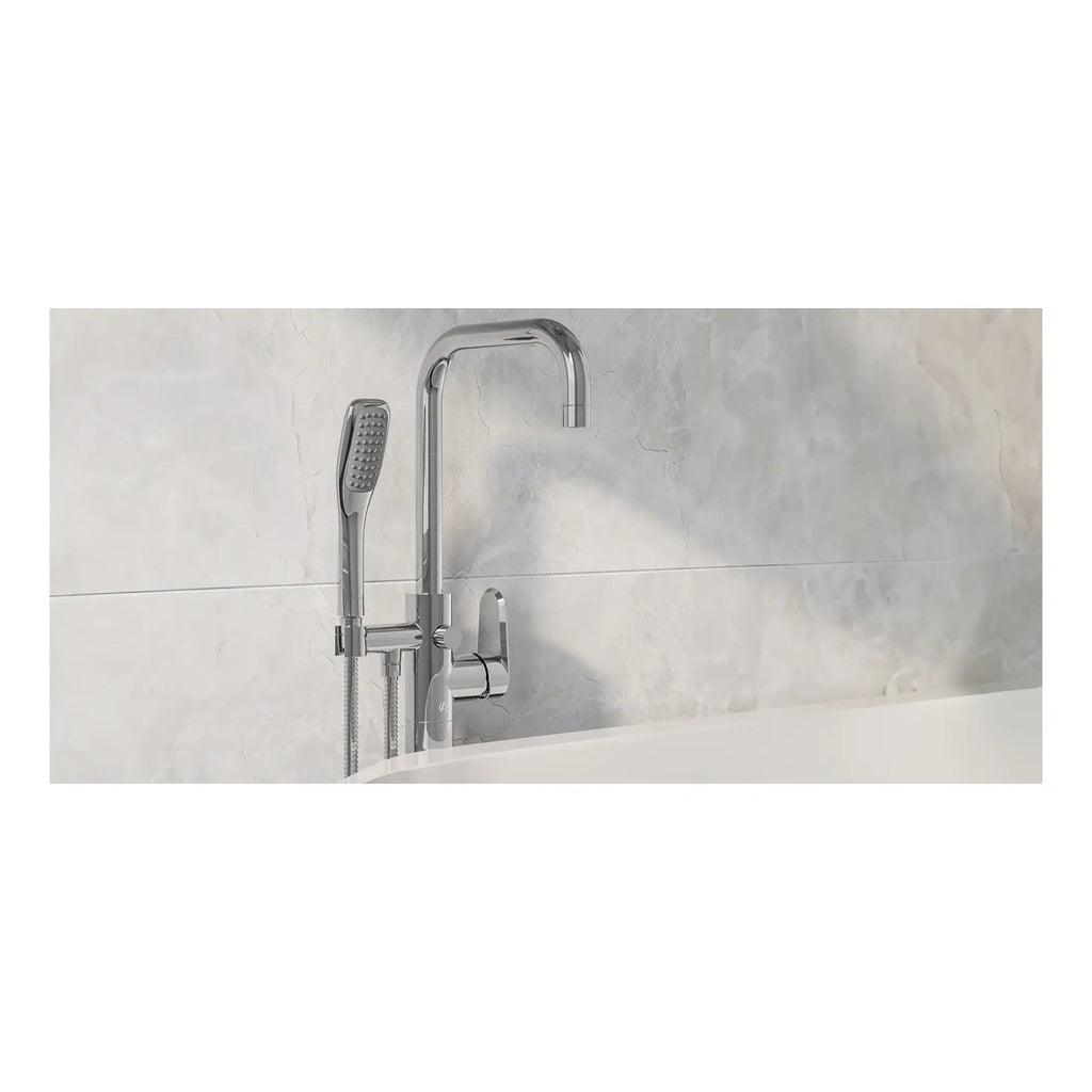 Sleek modern chrome bathtub filler and handheld shower head with a wall-mounted design, set against a polished marble wall, delivering luxury and functionality in contemporary bathroom décor.