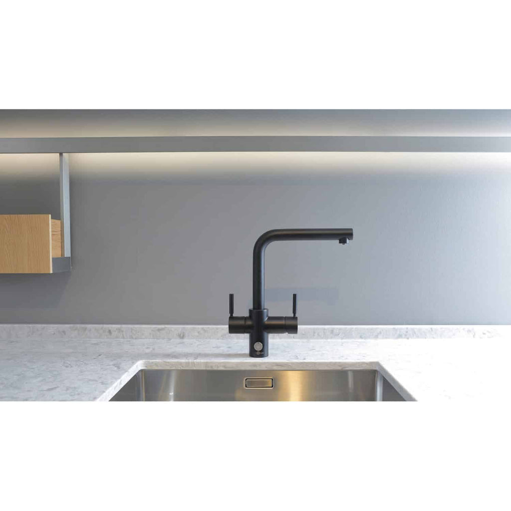 Modern matte black kitchen sink tap with sleek design and single lever, installed over a stainless steel sink in a contemporary kitchen, showcasing stylish kitchen plumbing fixtures.