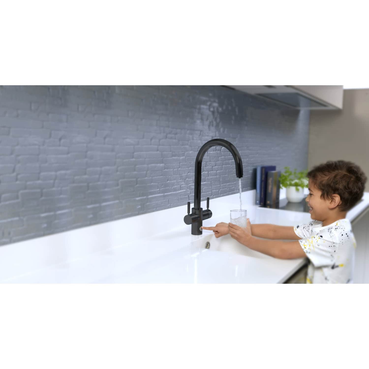Child washing hands under black kitchen faucet for kids, modern bathroom sink tap with water flow, safe and stylish design, ideal for family homes, promoting hygiene and fun handwashing.