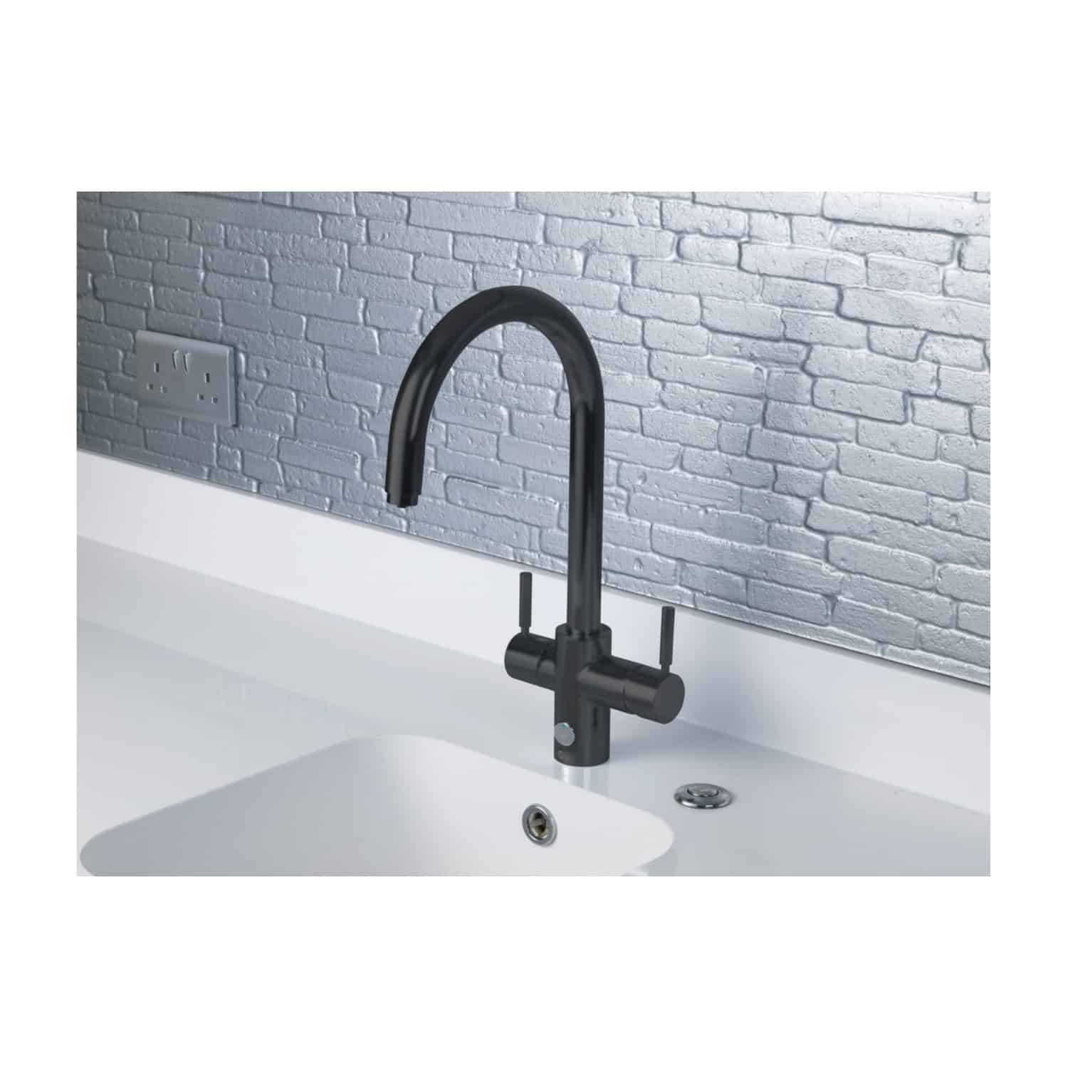 Sleek black kitchen tap with modern curved design mounted on a white countertop against a grey brick wall, highlighting stylish bathroom or kitchen fixtures.