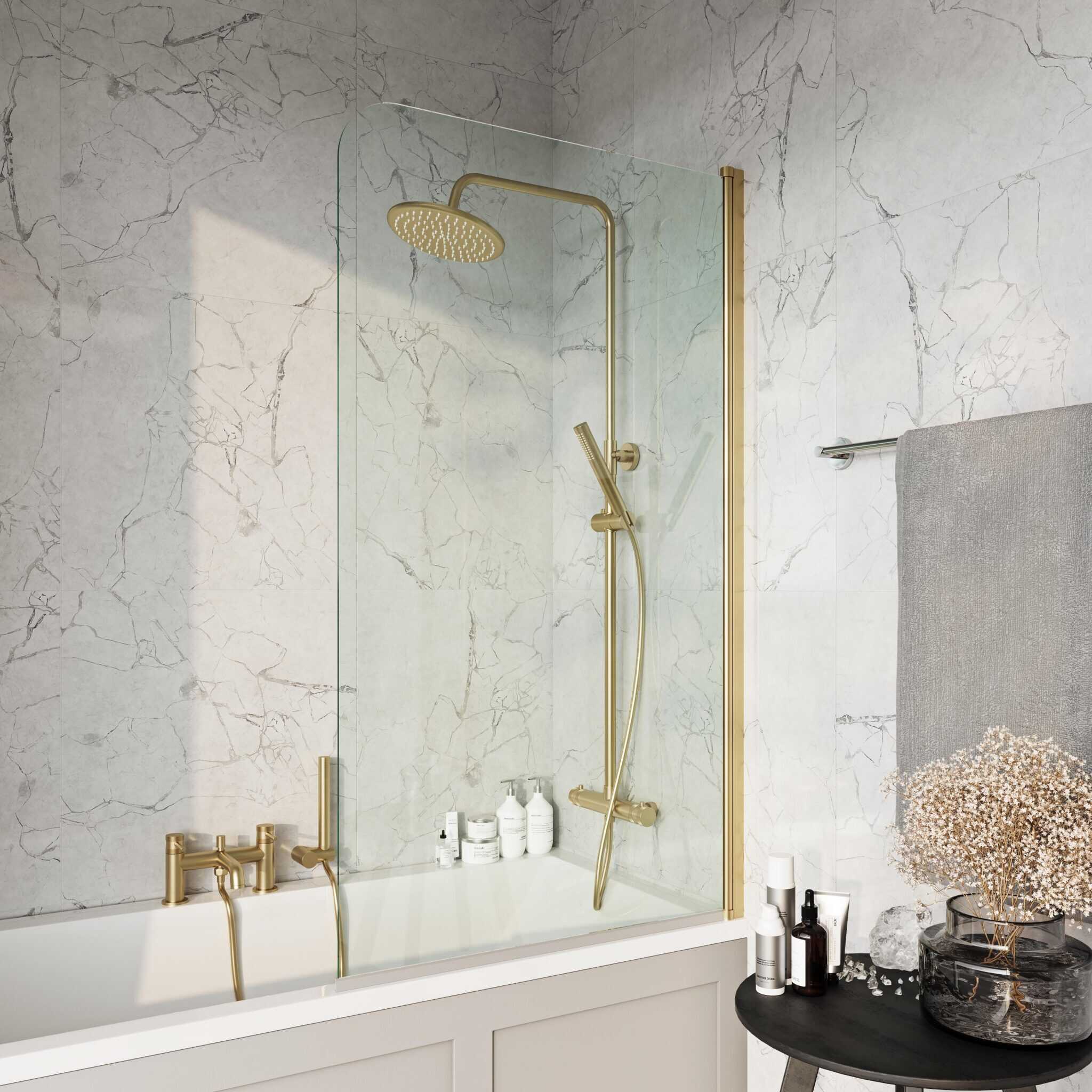 Elegant walk-in shower with gold fixtures and marble wall tiles, creating a luxurious bathroom aesthetic. Perfect for modern bathroom renovations and stylish shower upgrade ideas.