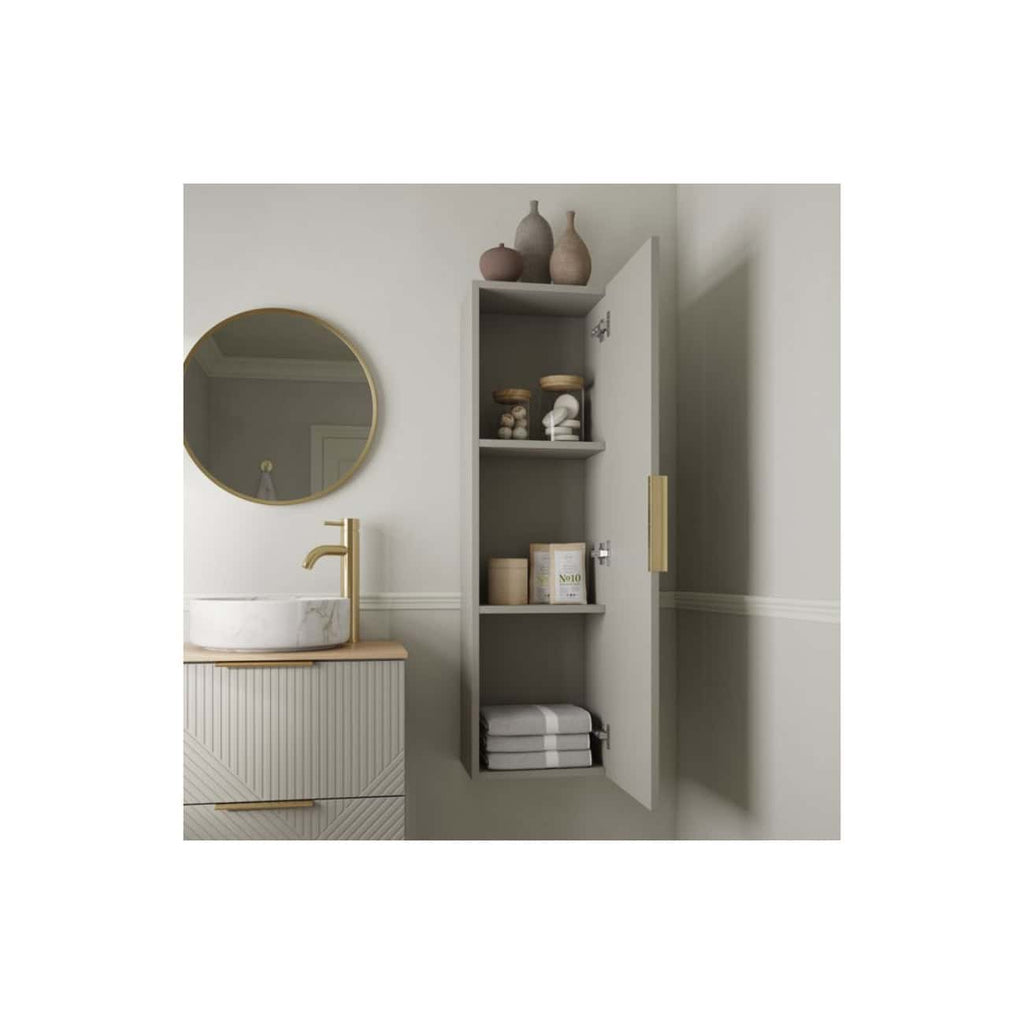 Elegant modern bathroom storage with a tall grey cabinet, neatly organising towels and toiletries, complemented by a stylish marble sink vanity and gold fixtures for a luxurious bathroom look.