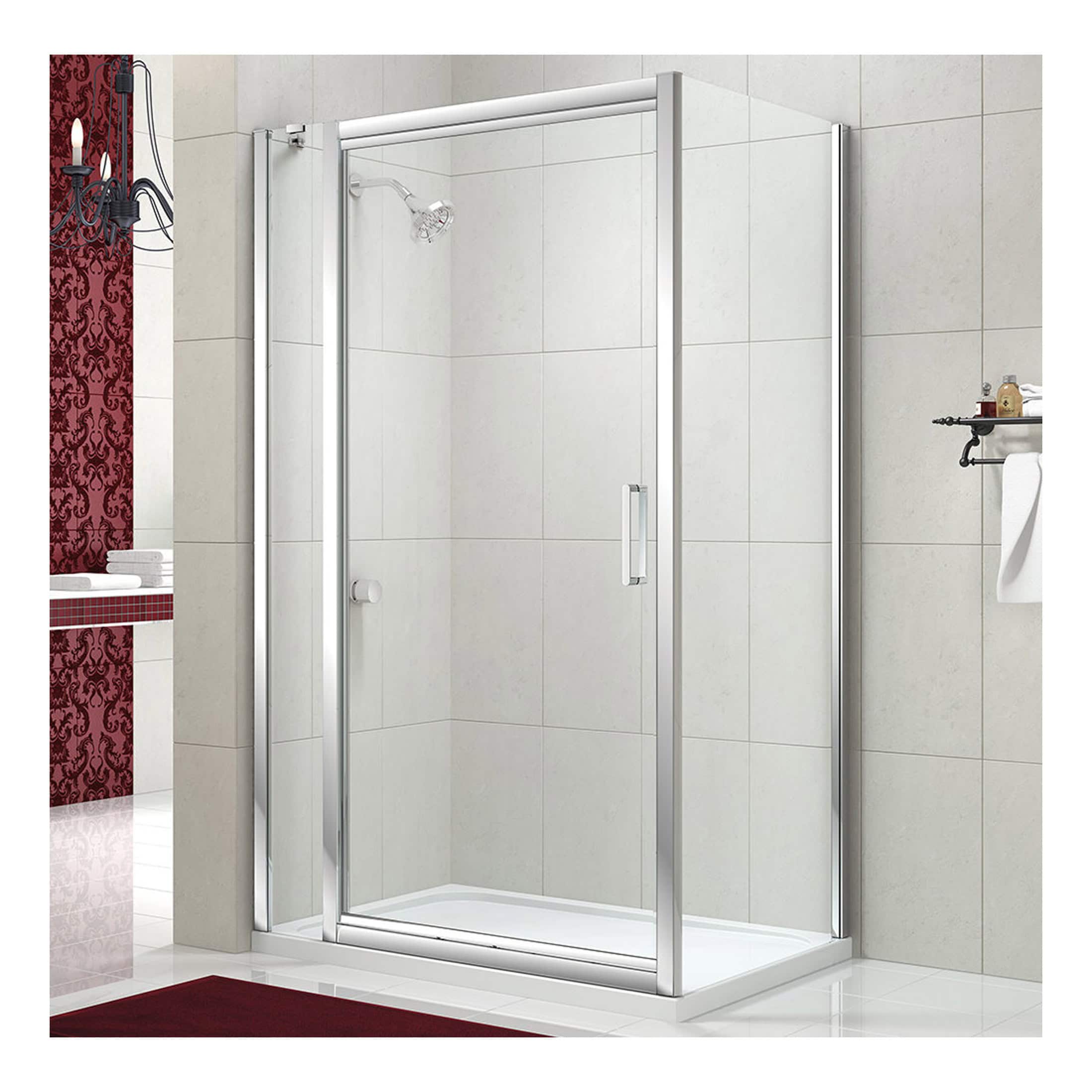 Shower enclosure with glass doors and chrome frame in a modern bathroom setting.