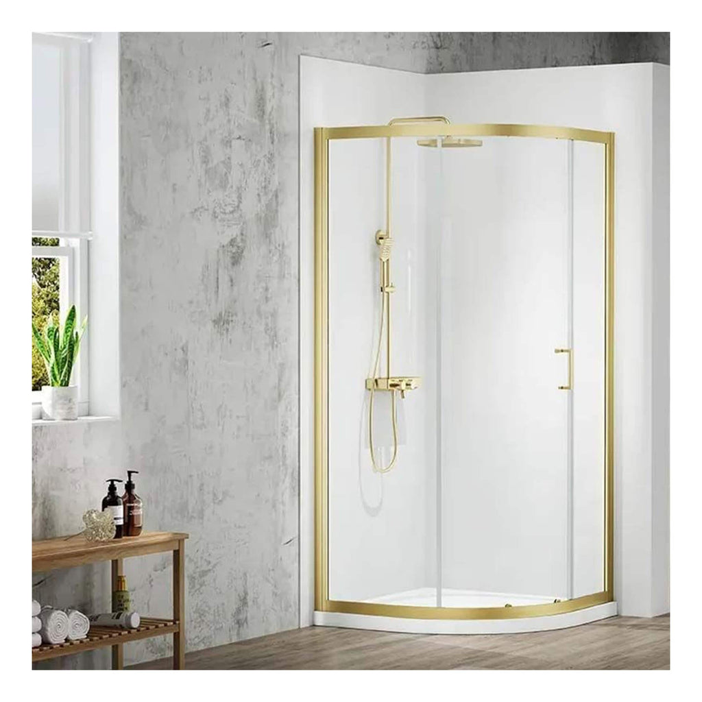 Shower enclosure with gold frame and glass panels in modern bathroom setting.