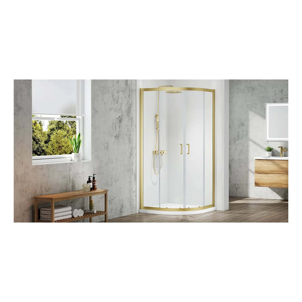 Shower enclosure with brass frame in a modern bathroom with textured grey walls, wooden vanity, and natural light from a window, combining contemporary bathroom design and quality shower solutions.