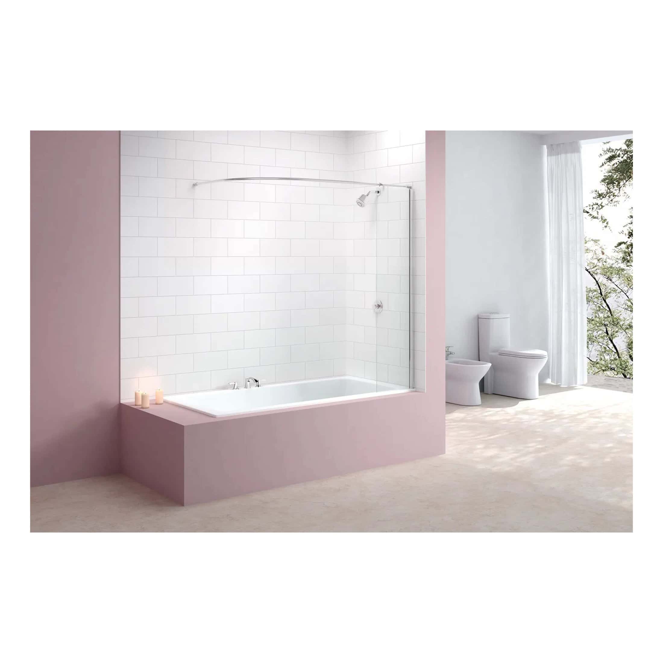 Bright modern bathroom featuring a built-in bathtub with a glass shower screen, white subway tiles, and fresh white fixtures set against soft pastel pink walls and large windows with natural light.