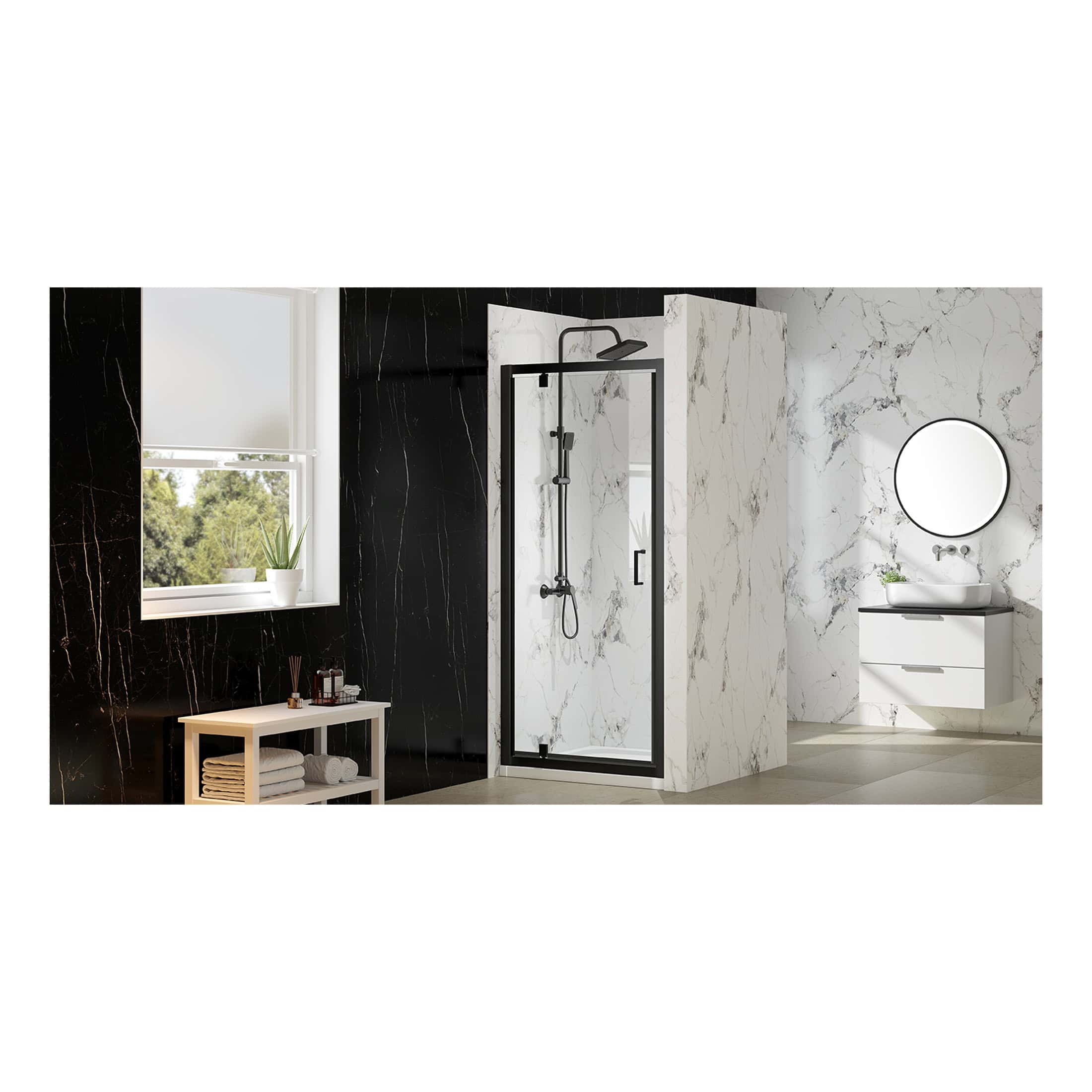 Shower enclosure with black trim and marble effect walls in modern bathroom, featuring a minimalist white vanity and round mirror, ideal for contemporary bubble bathroom designs.